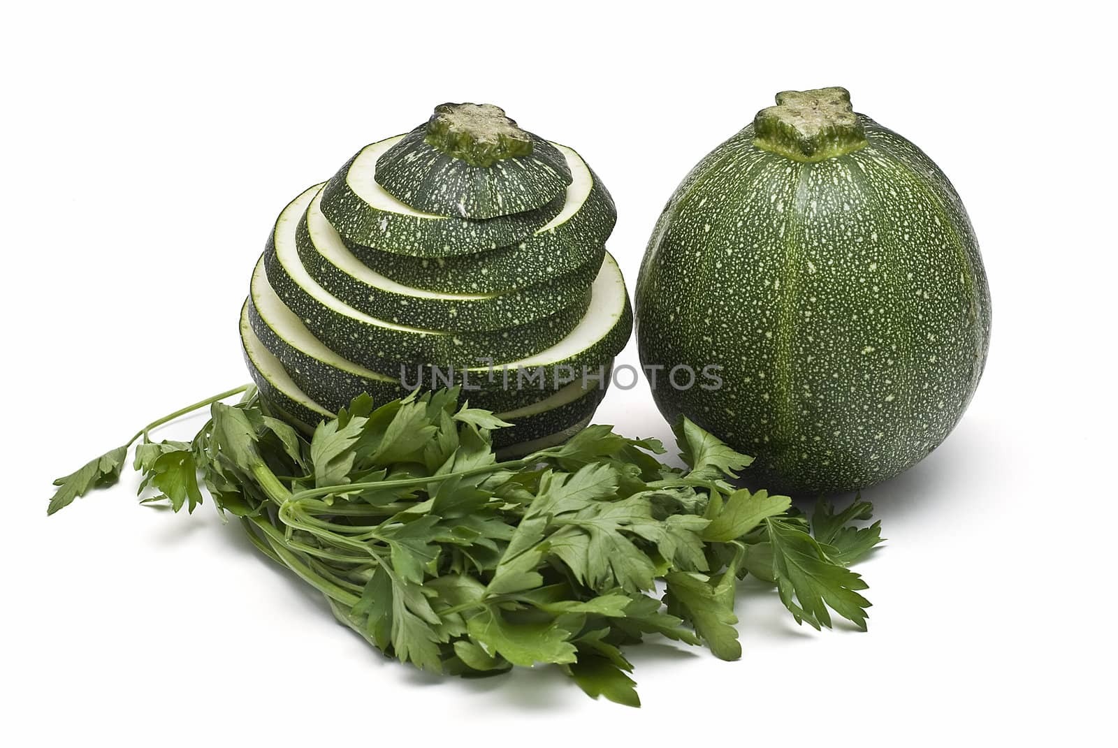 Round zucchini isolated on a white background.