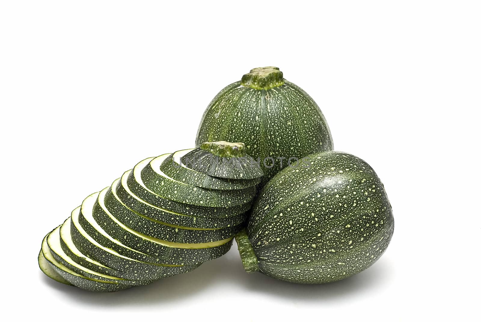 Round zucchini isolated on a white background.