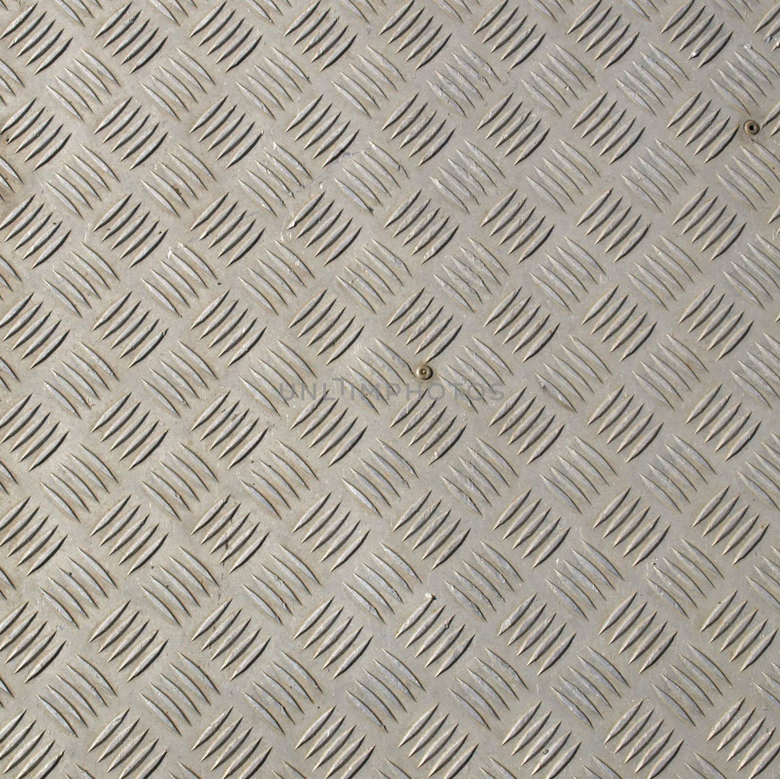Diamond steel plate useful as a background