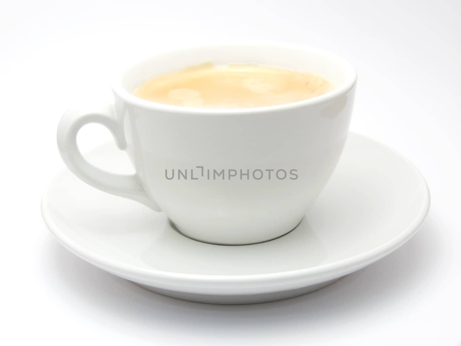 A cup of coffee with foam isolated on a white background