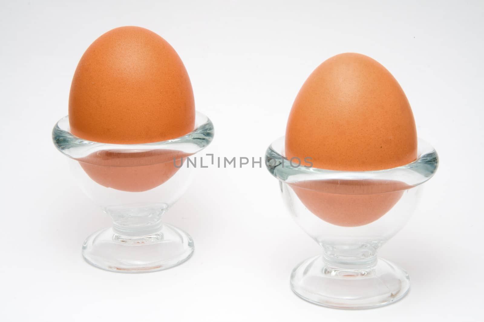 Two eggs in a glass cup