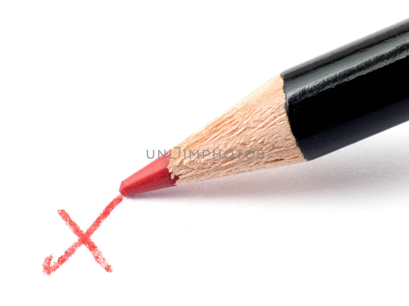 Closeup of a Pencil and checkmark isolated on a white background