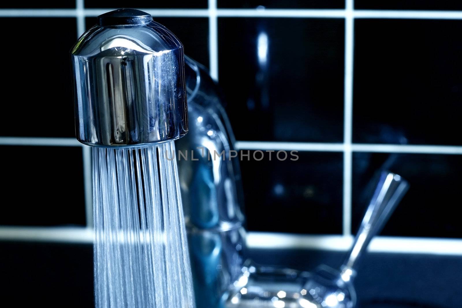 Modern Faucet with running water in blue 