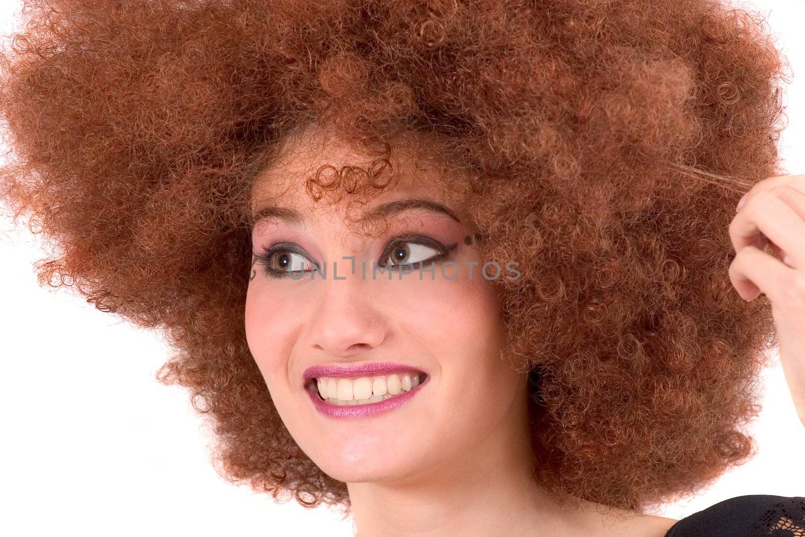 Pretty teen with a red afro wig