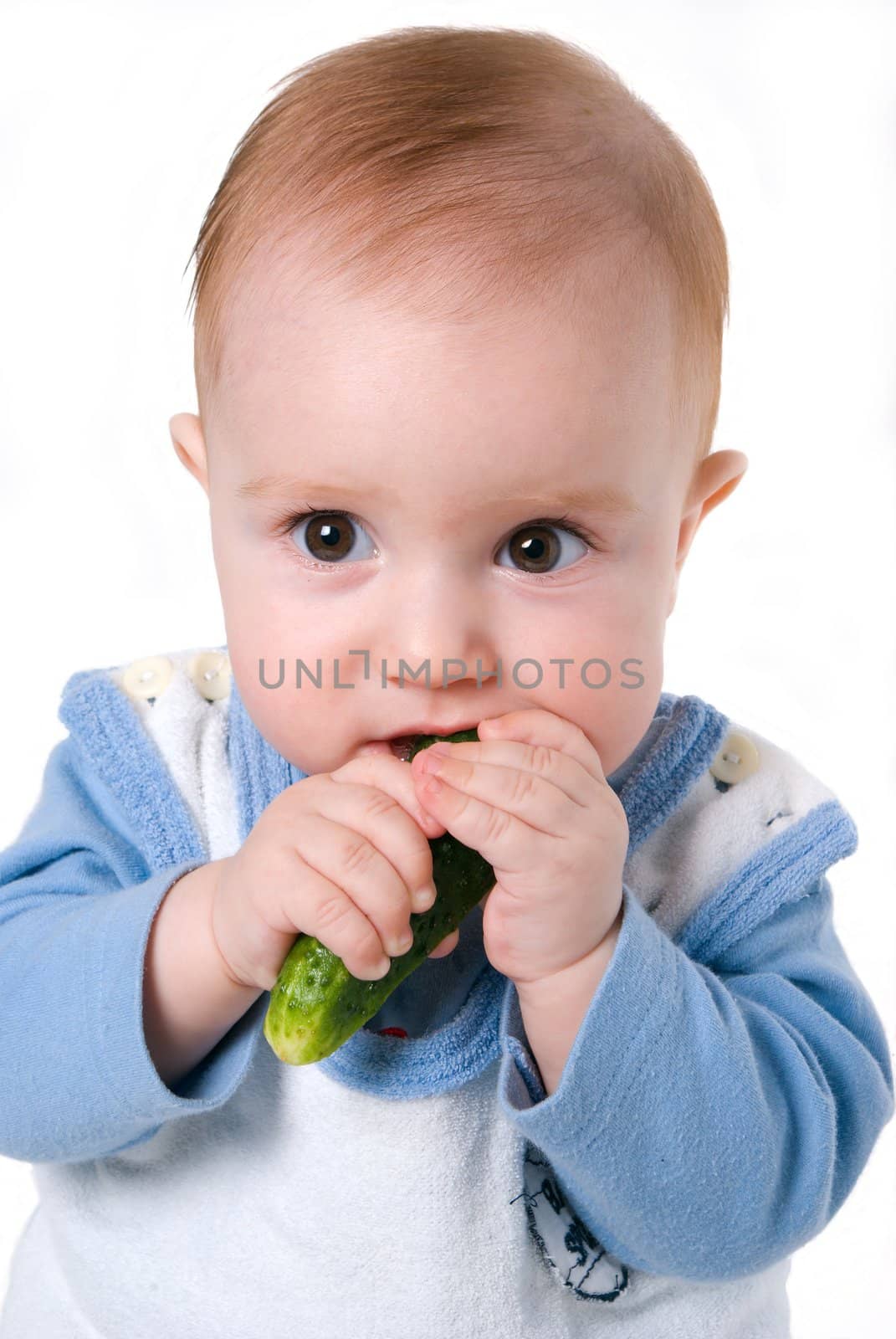 tot and cucumber,small boy eats fresh cucumber