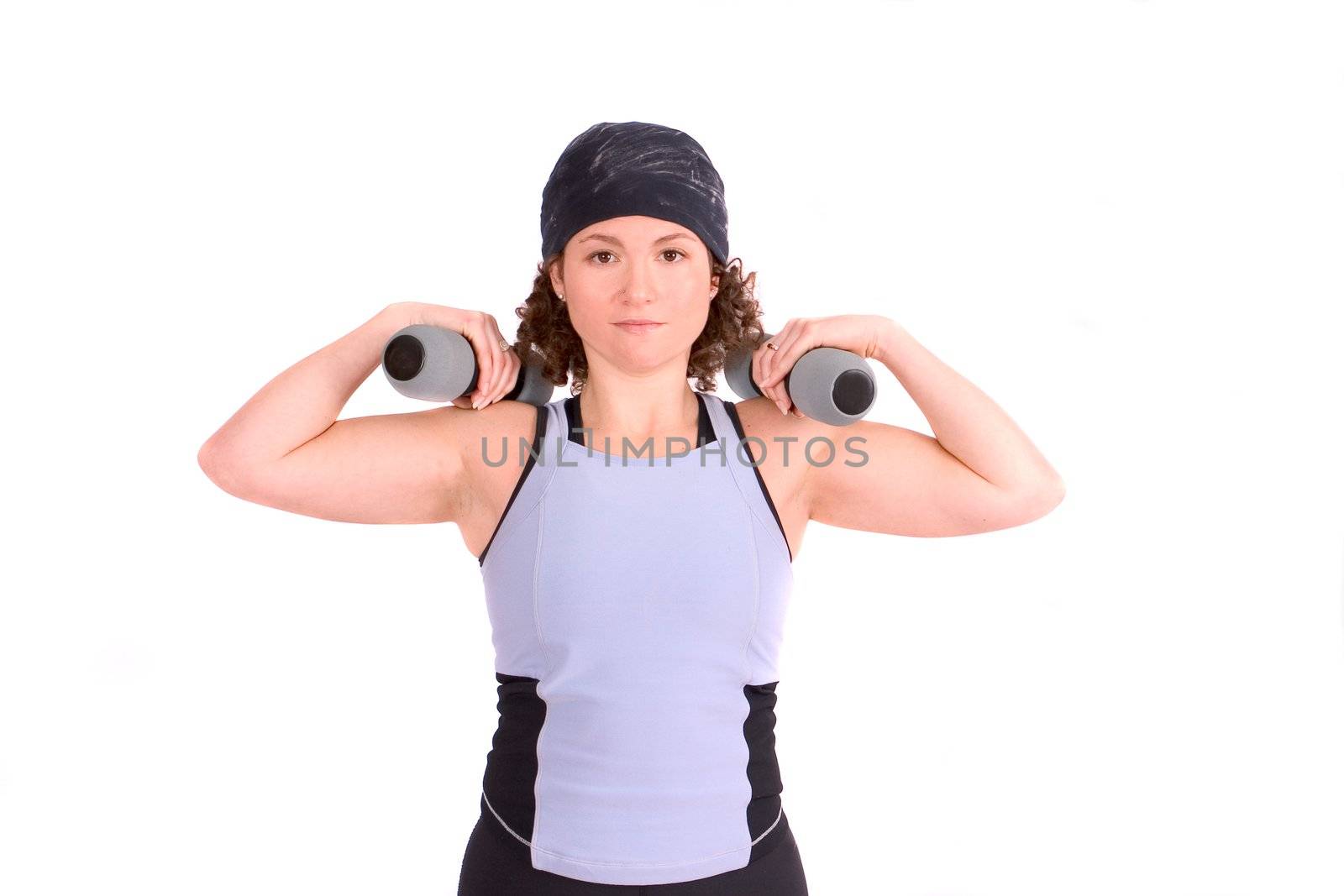 Attractive young woman excercising with weights