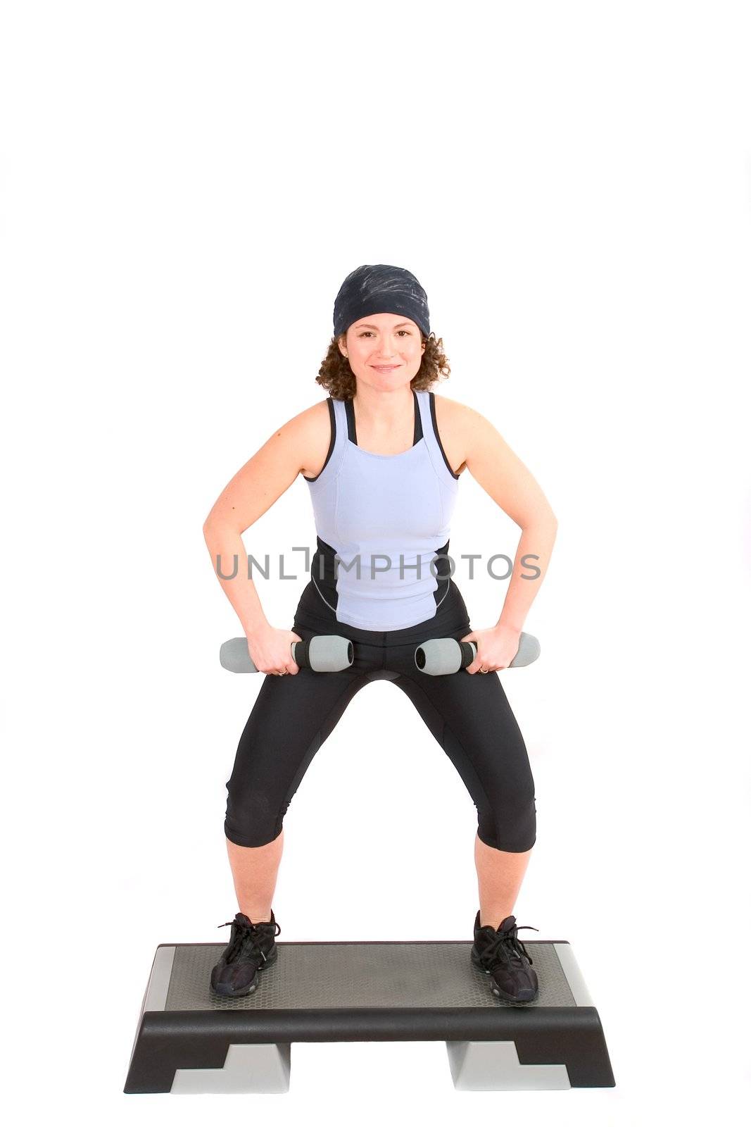 Woman doing squats on top of a step