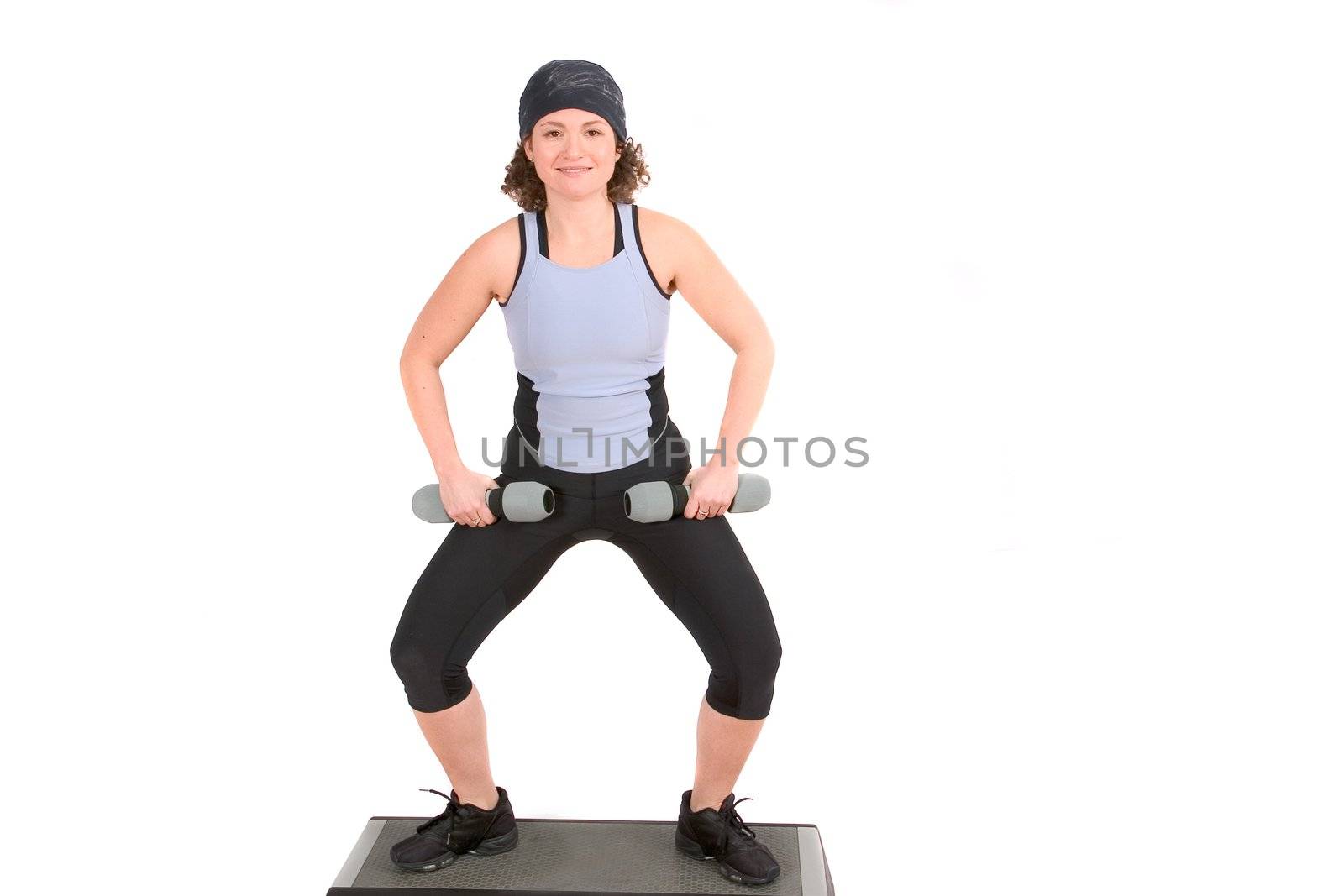 Woman doing squats on top of step by Fotosmurf
