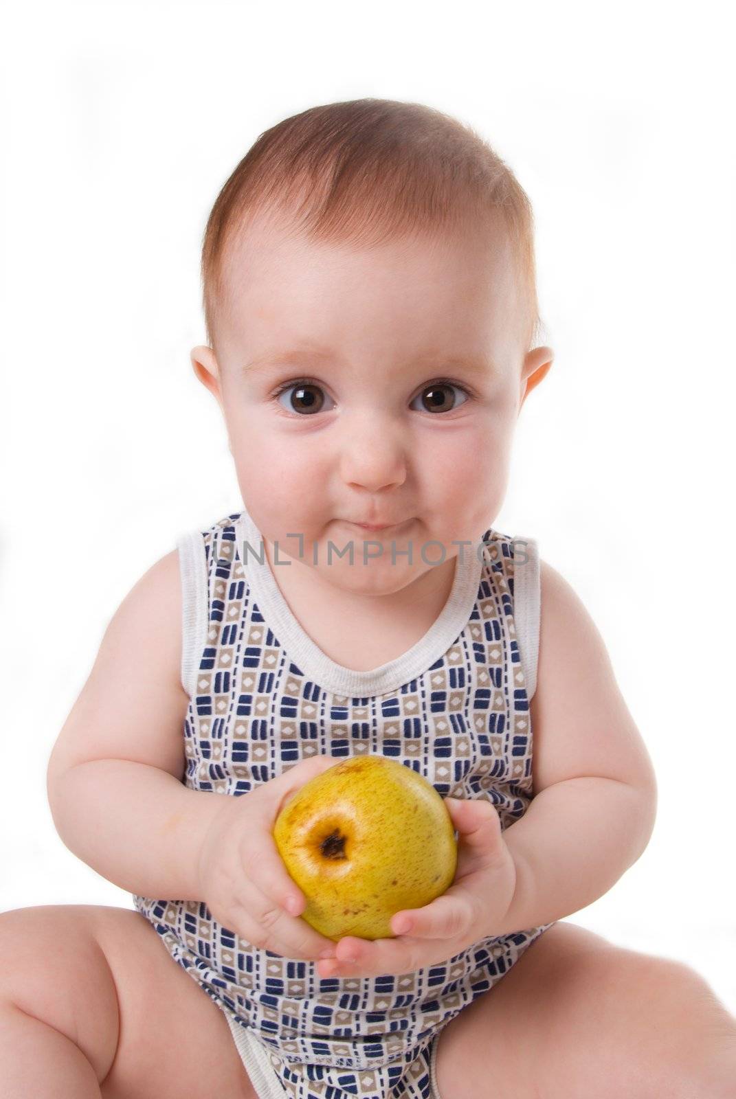 Study of the pear by small boy, useful and tasty fruit