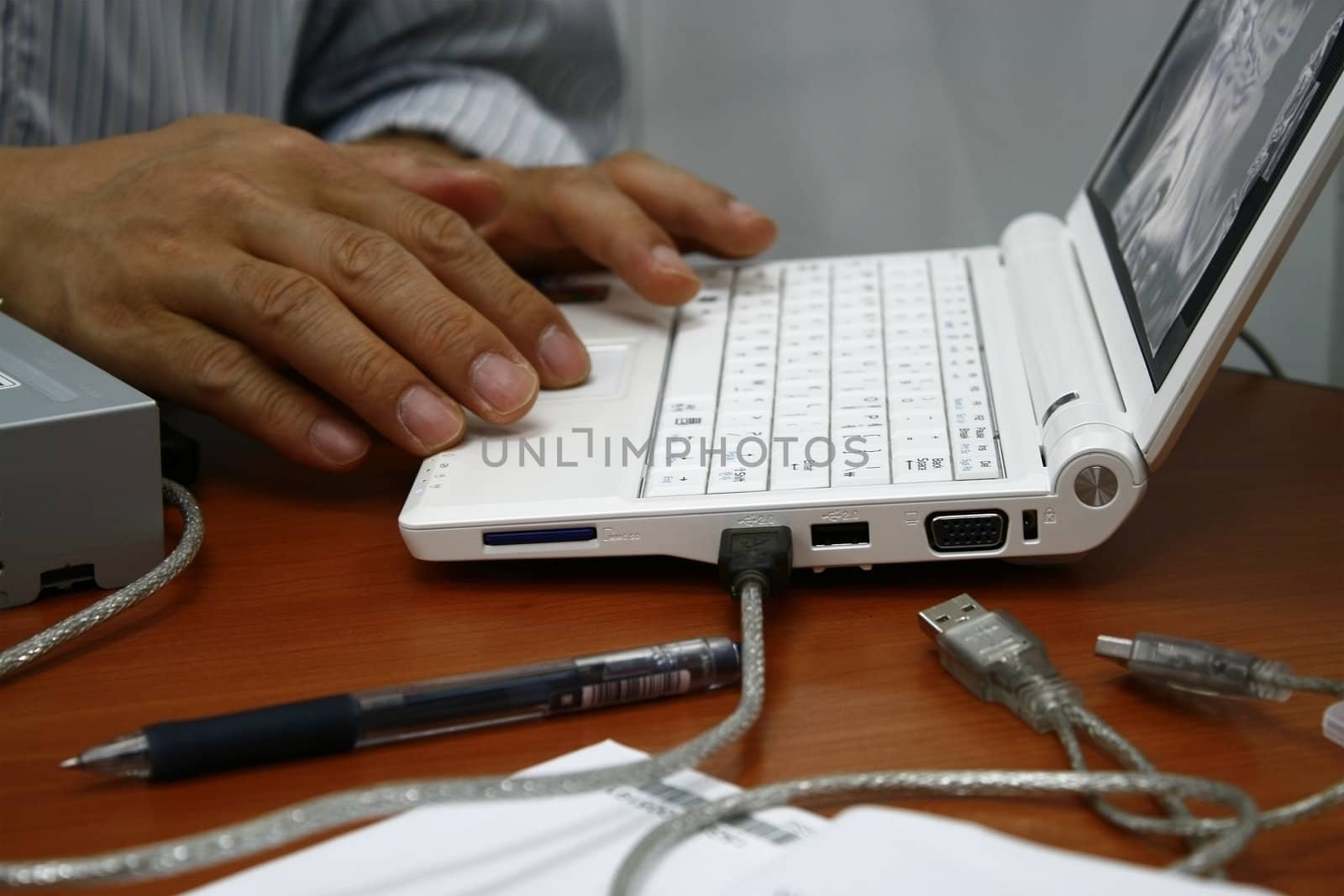 a businessman using new laptop with usb 