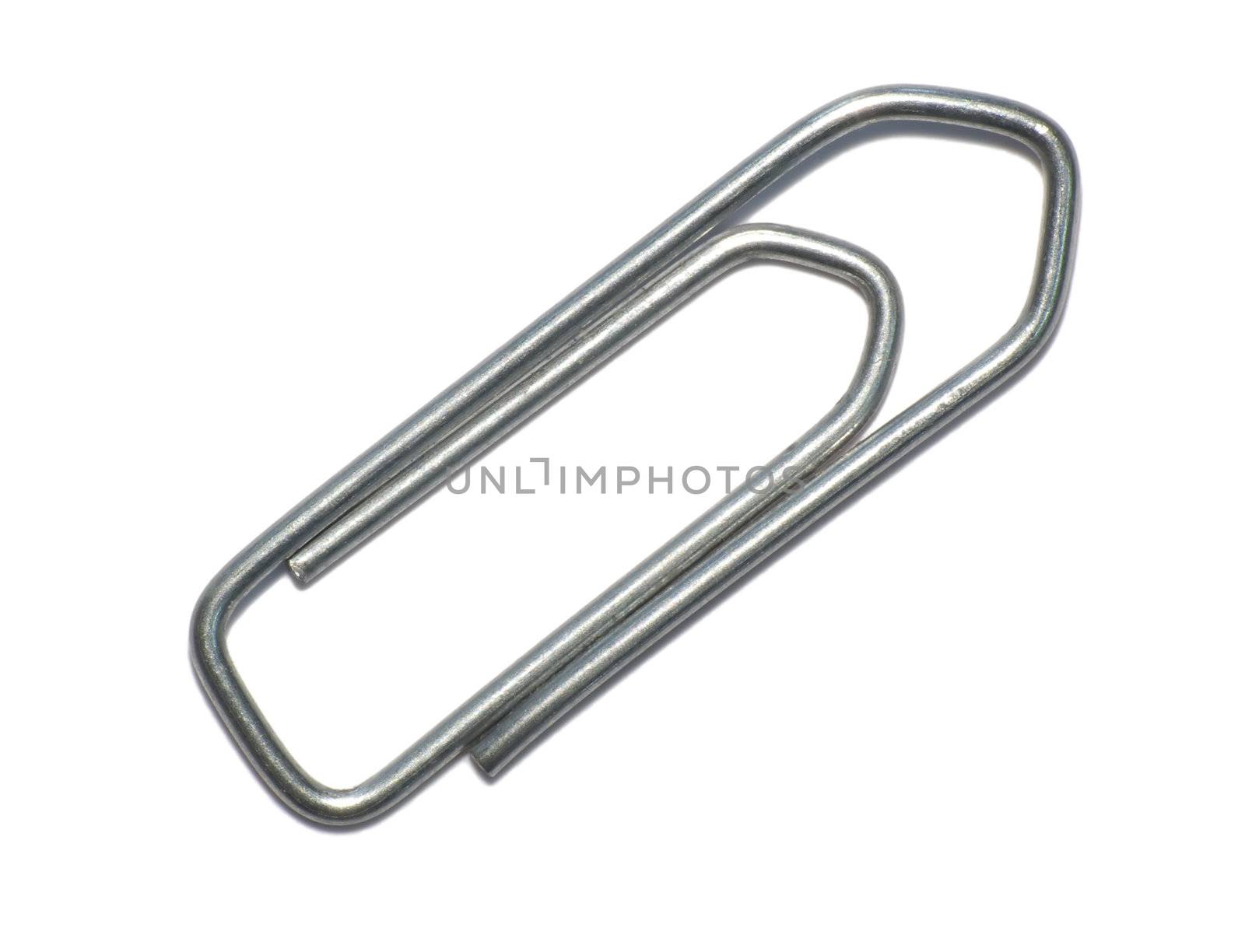 Metalic paperclip on a white background with shadow