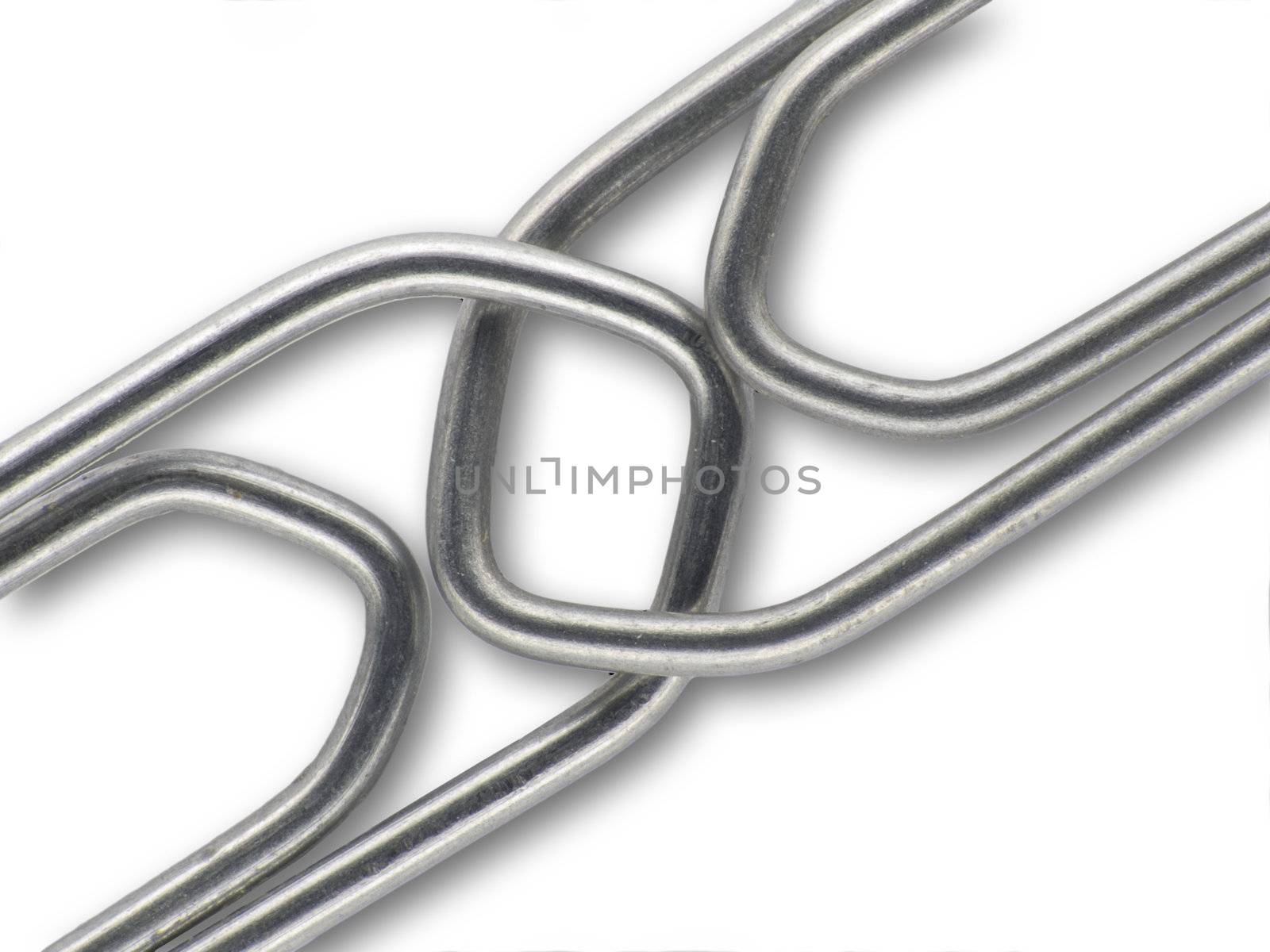 Two linked paperclips on a white background with shadow