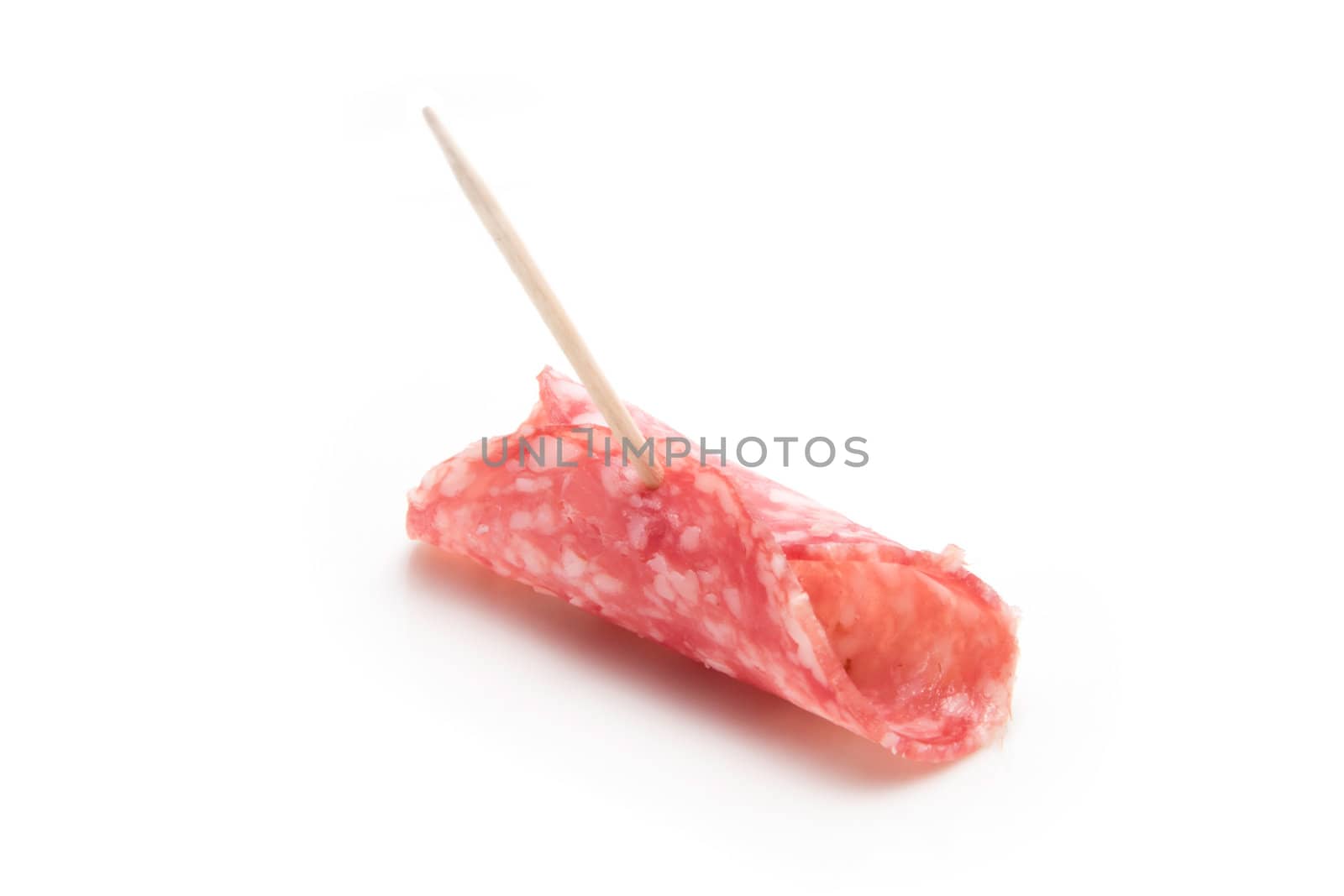 Slice of salami on a toothpick