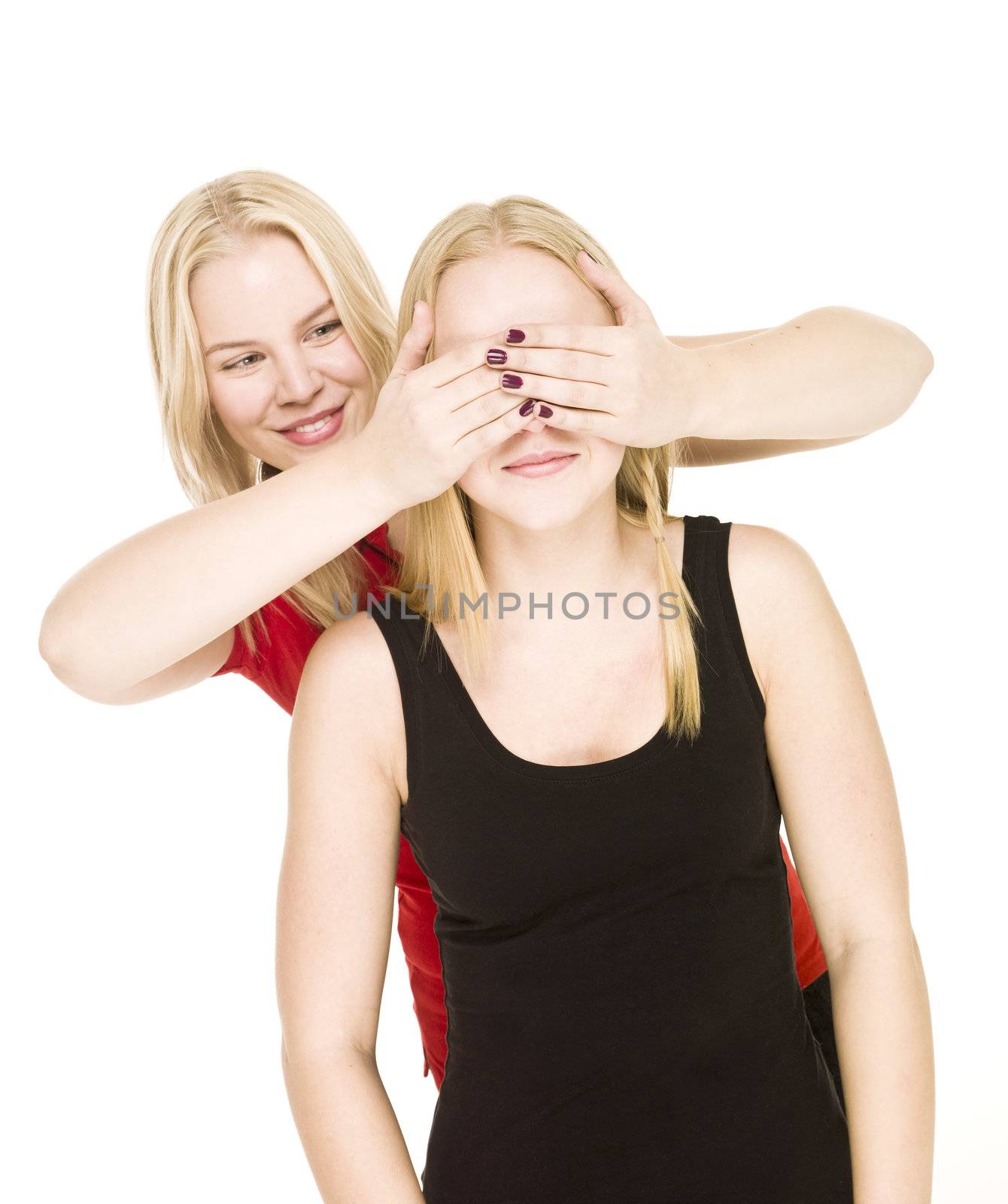 Girls playing Peek-a-boo isolated on white background
