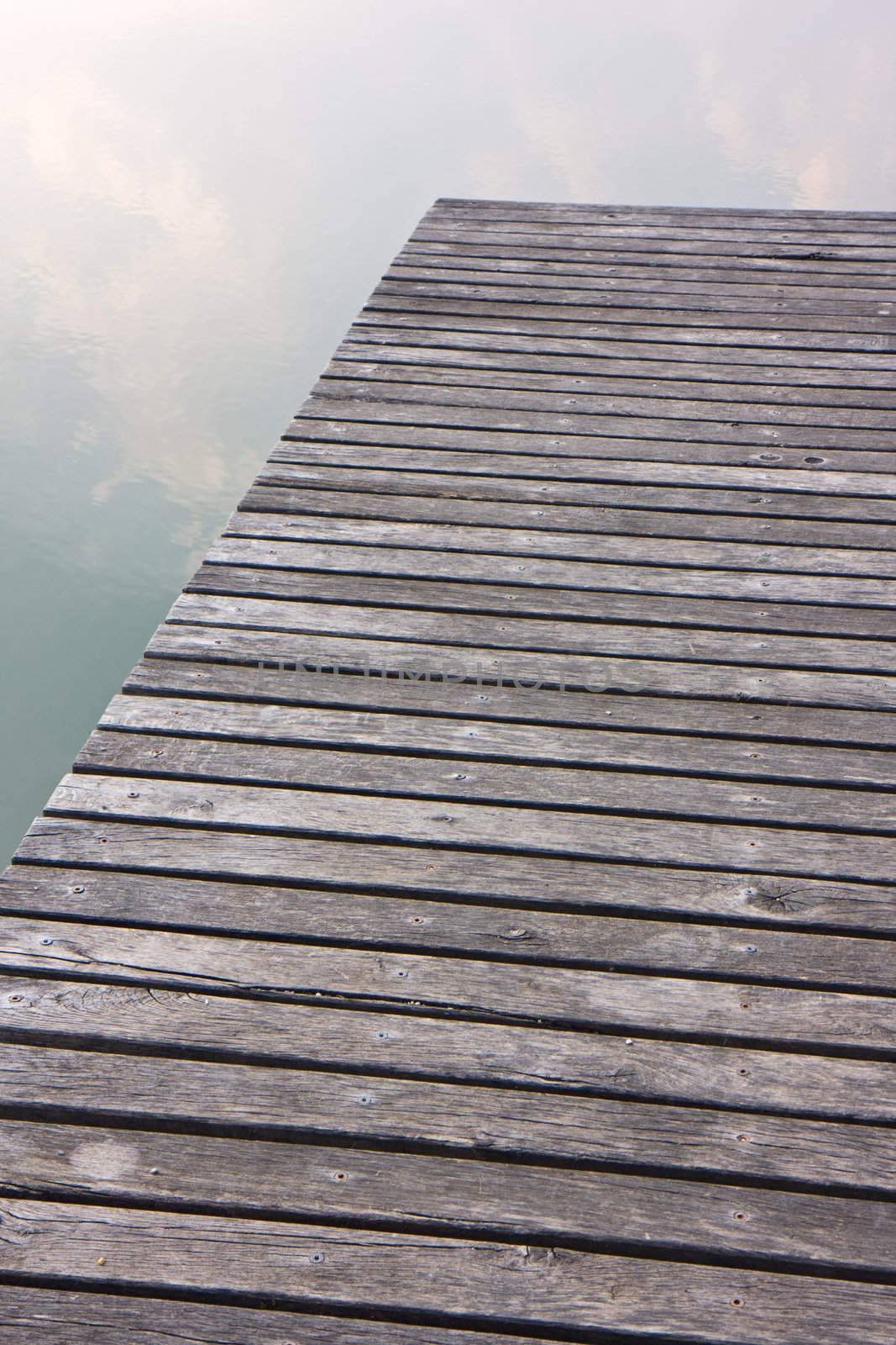 abstract view of a wooden footbridge on a lake