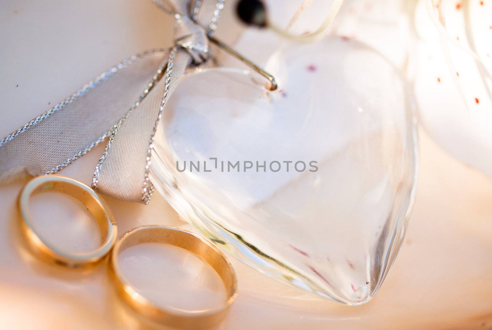 Two wedding rings a love heart and a flower by Jaykayl