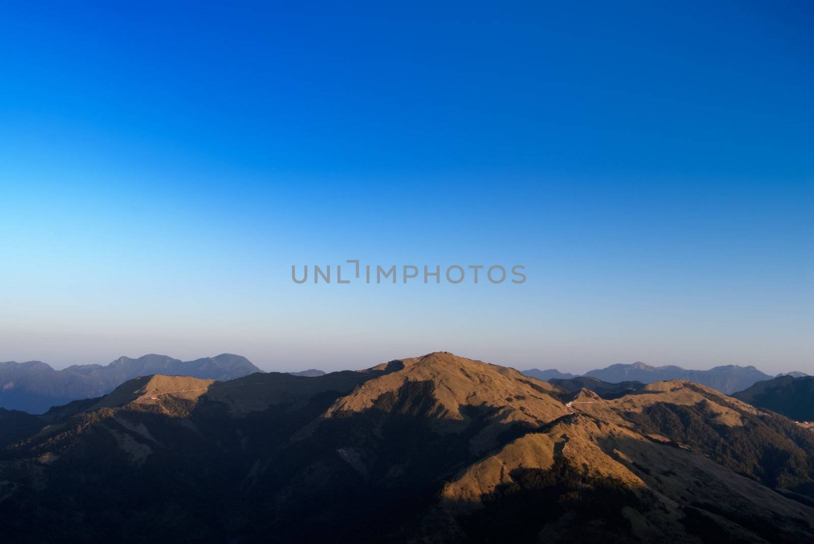 It is the golden mountain with blue sky.