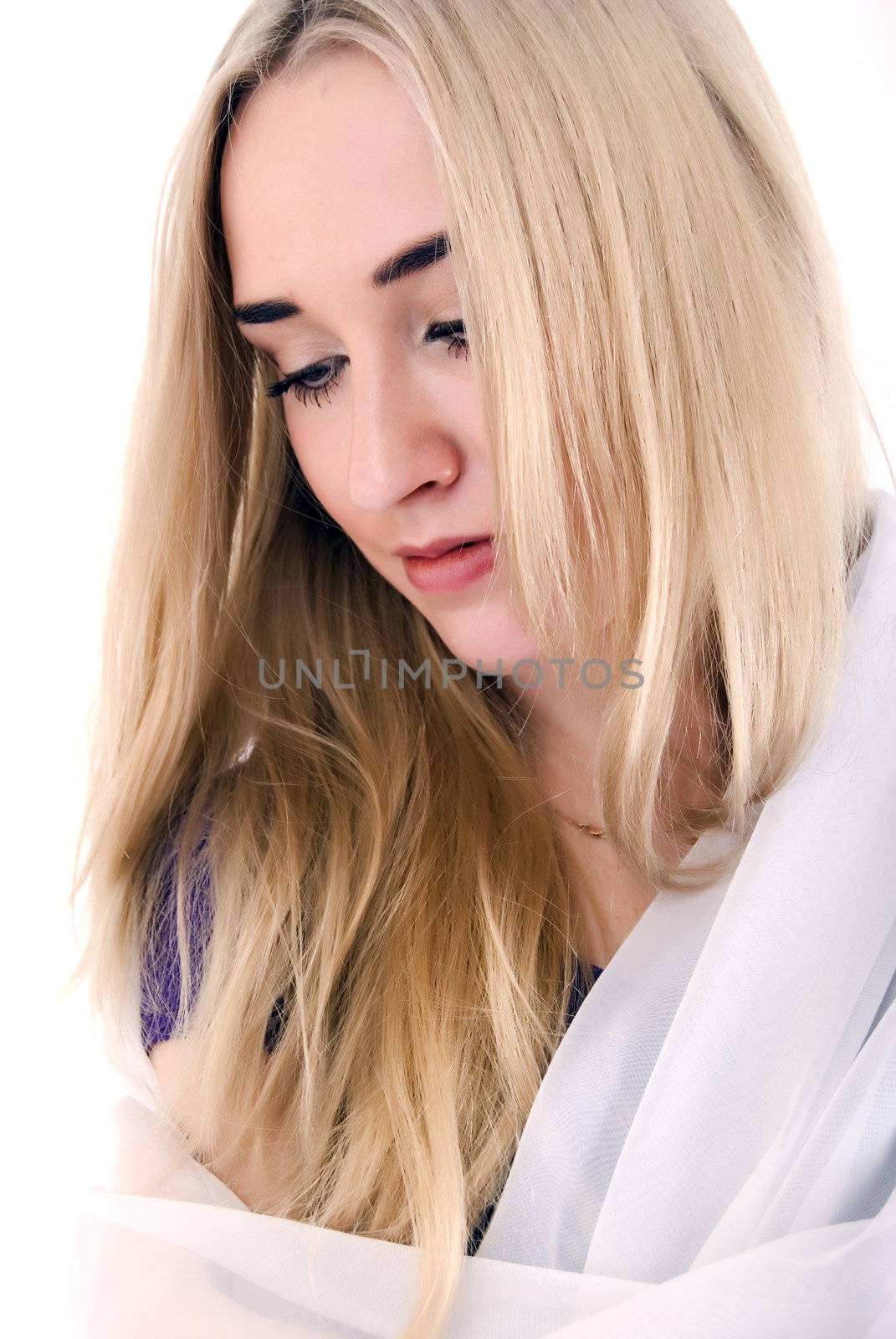 Portrait of a young beautiful blonde looking sad