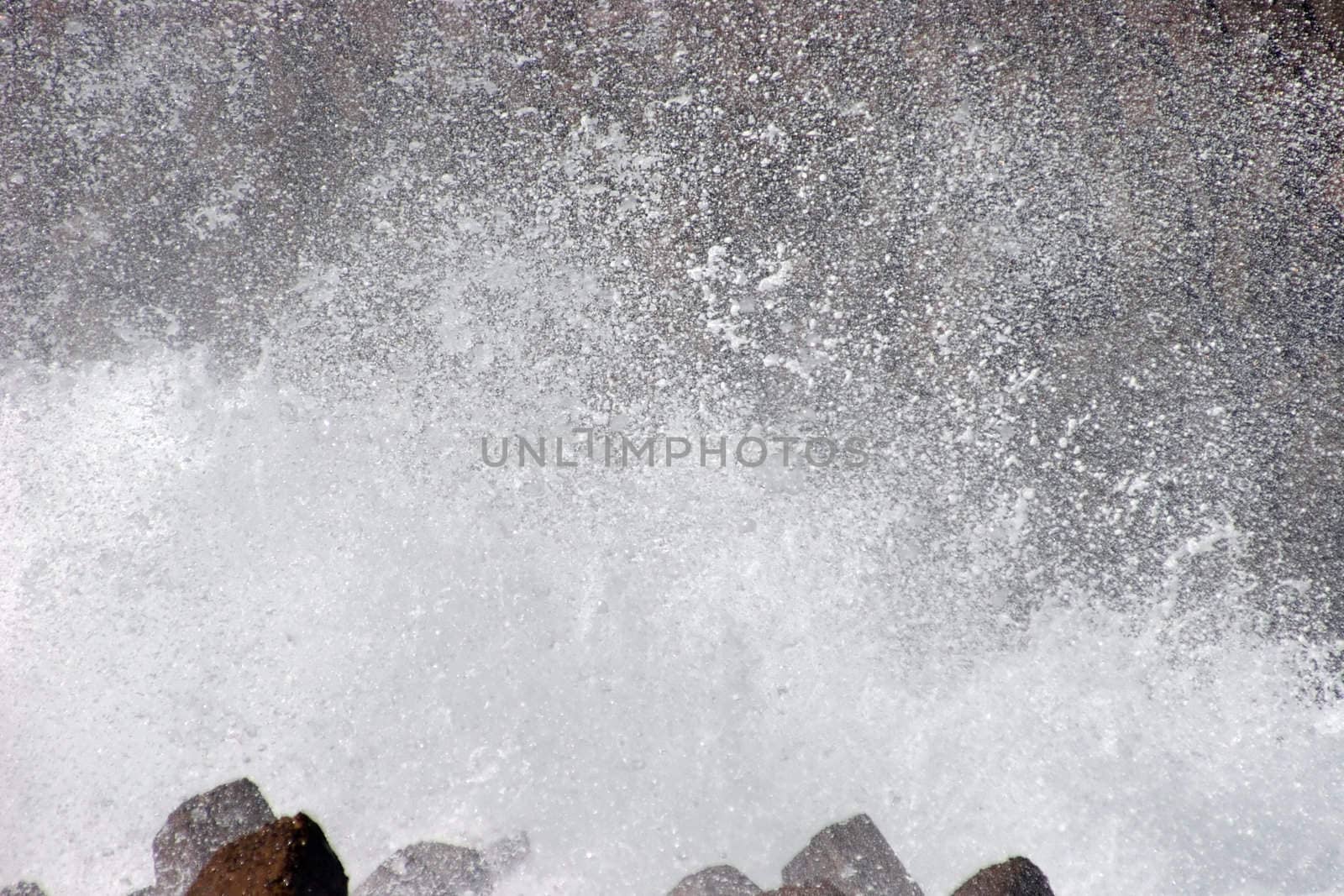 Spray from wave hitting the shore by azotov