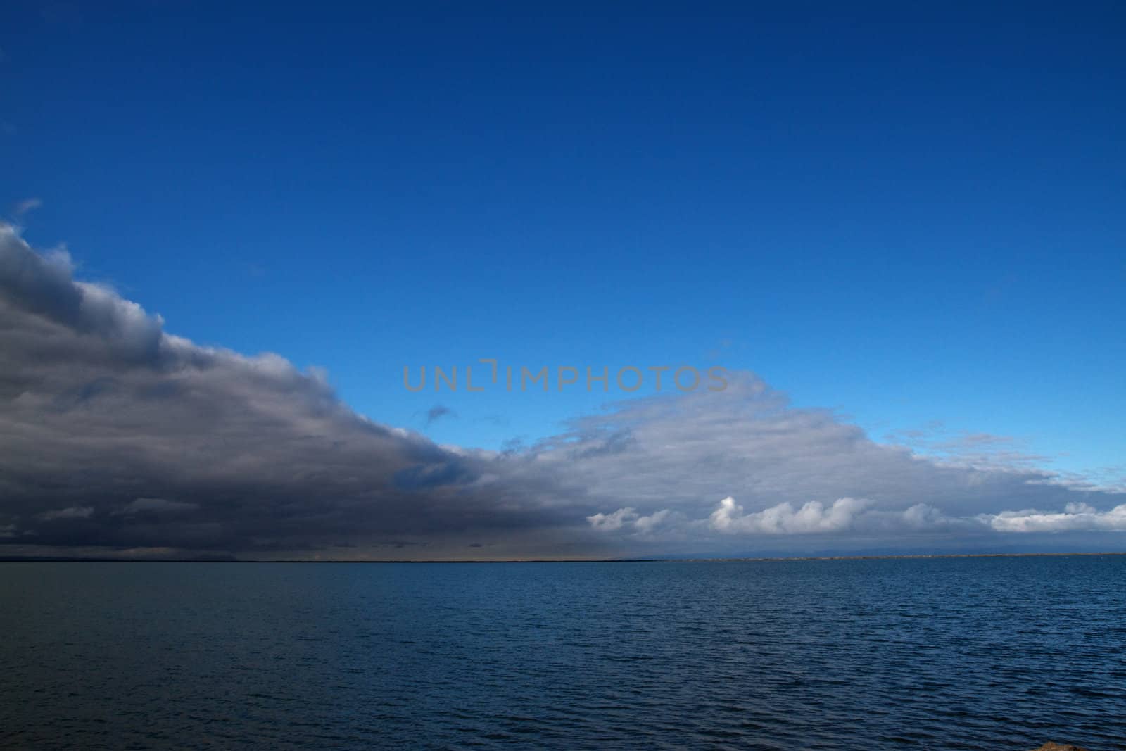 Juan de Fuca Storm front blue sky by bobkeenan