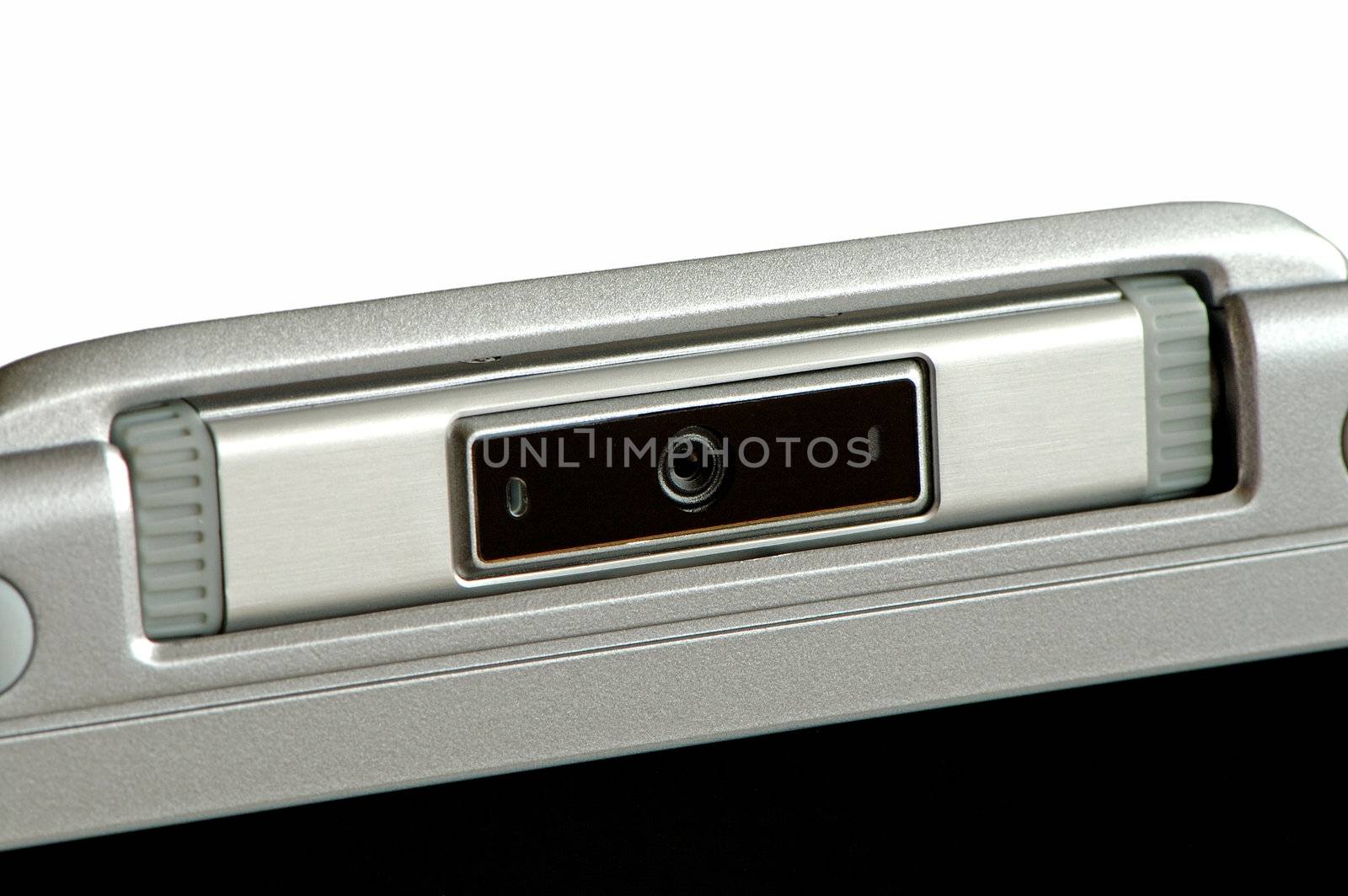 Close up of laptop computer's video cam over white