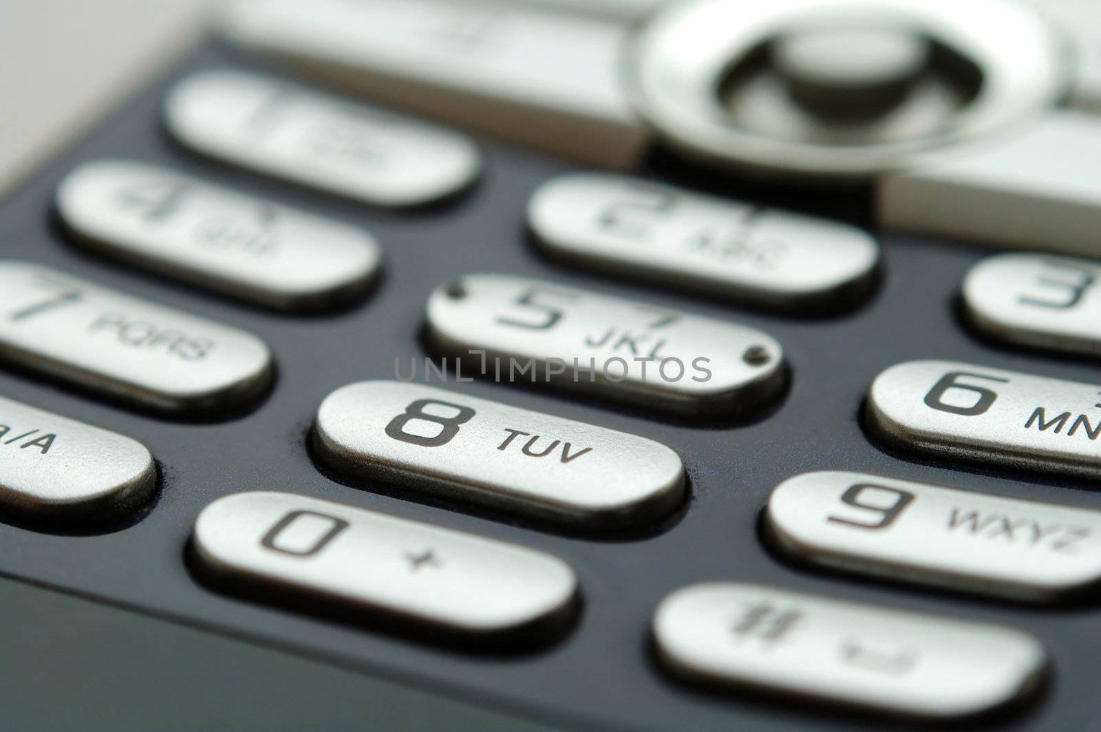 A close up shot of mobile keypad under light