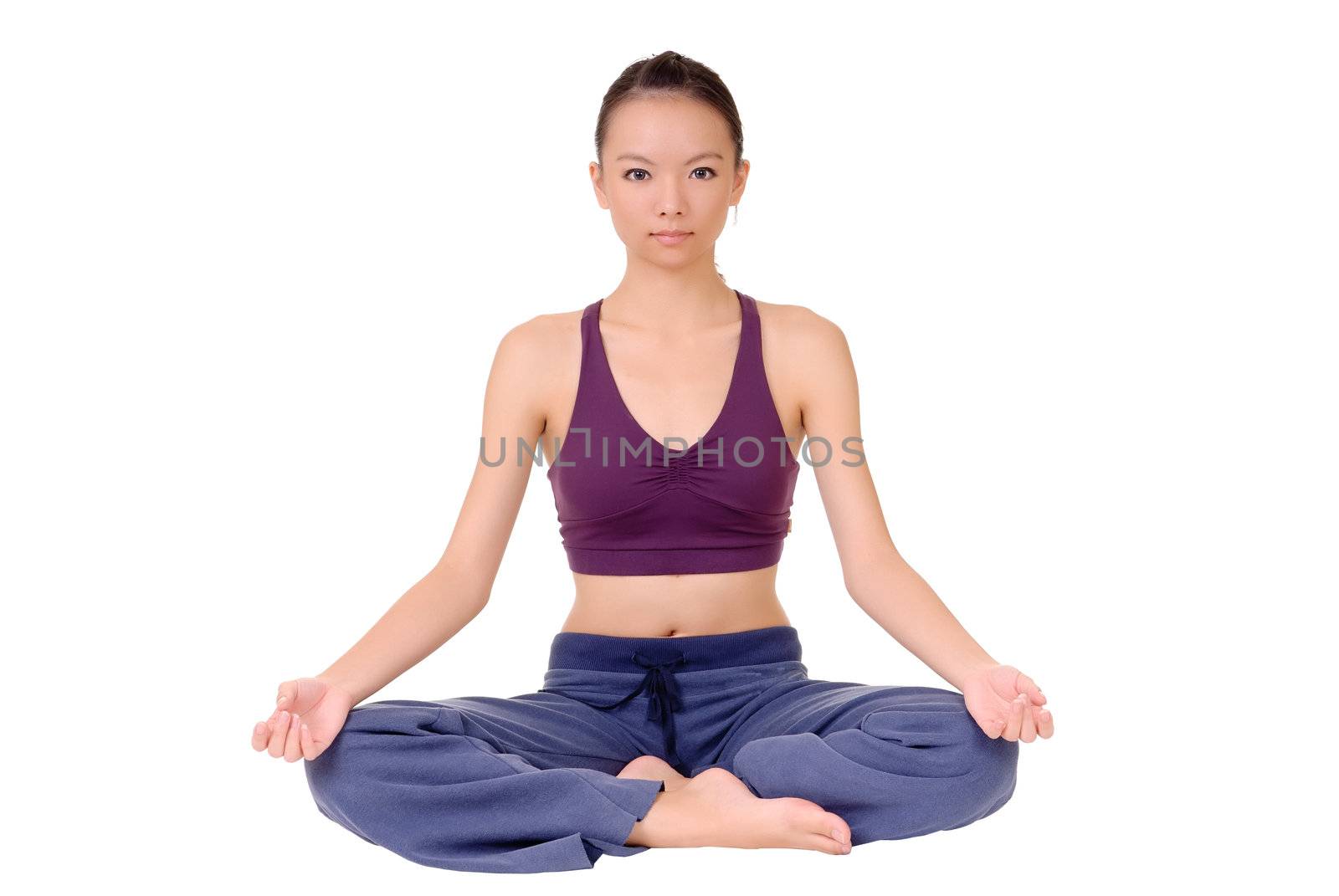 Lotus yoga pose by young Asian woman sitting on ground isolated over white.