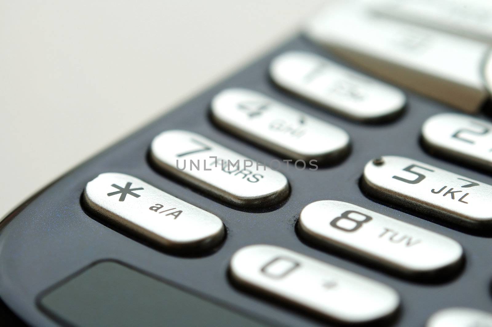 A close up shot of mobile keypad under light