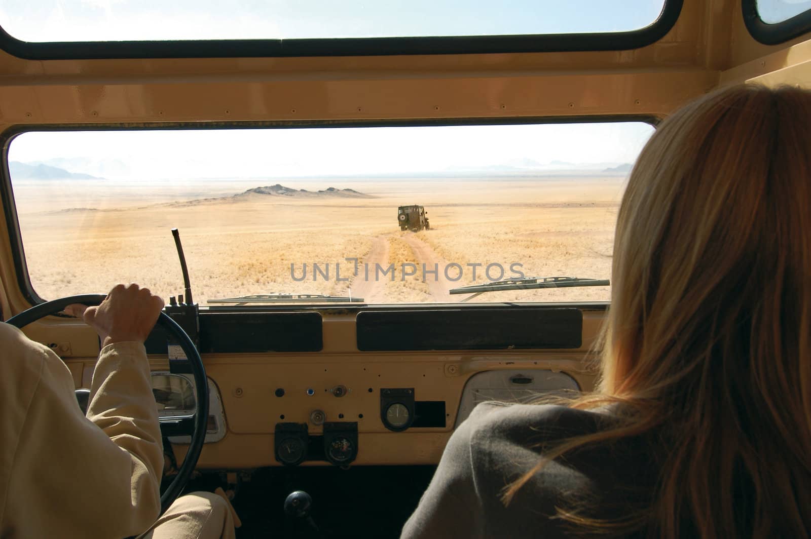 Woman and driver in the desert - Safari