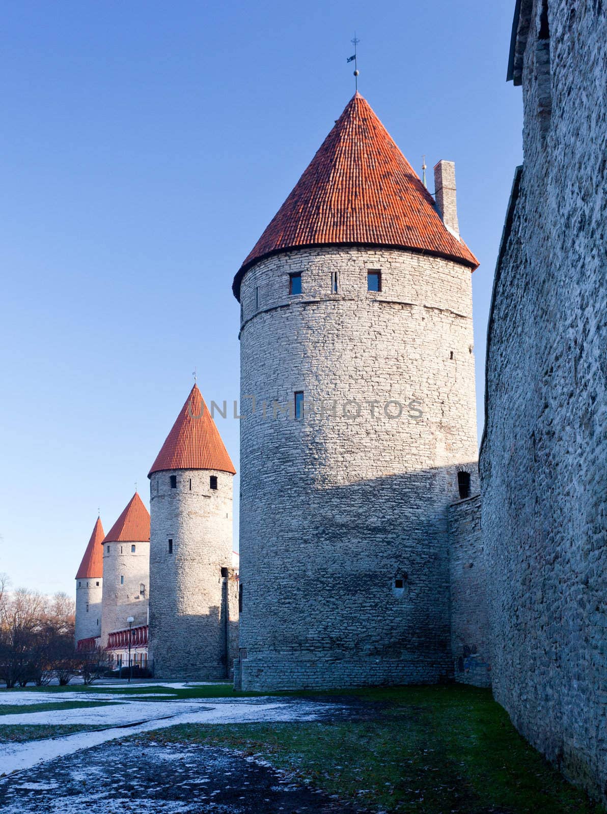 Ancient stone walls of Tallinn with four towers in alignment