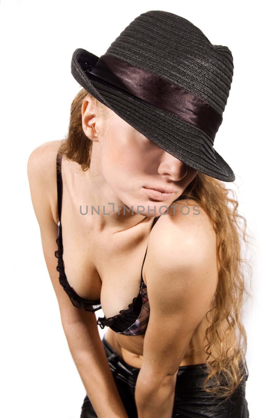 Beautiful woman with hat on her eyes on white