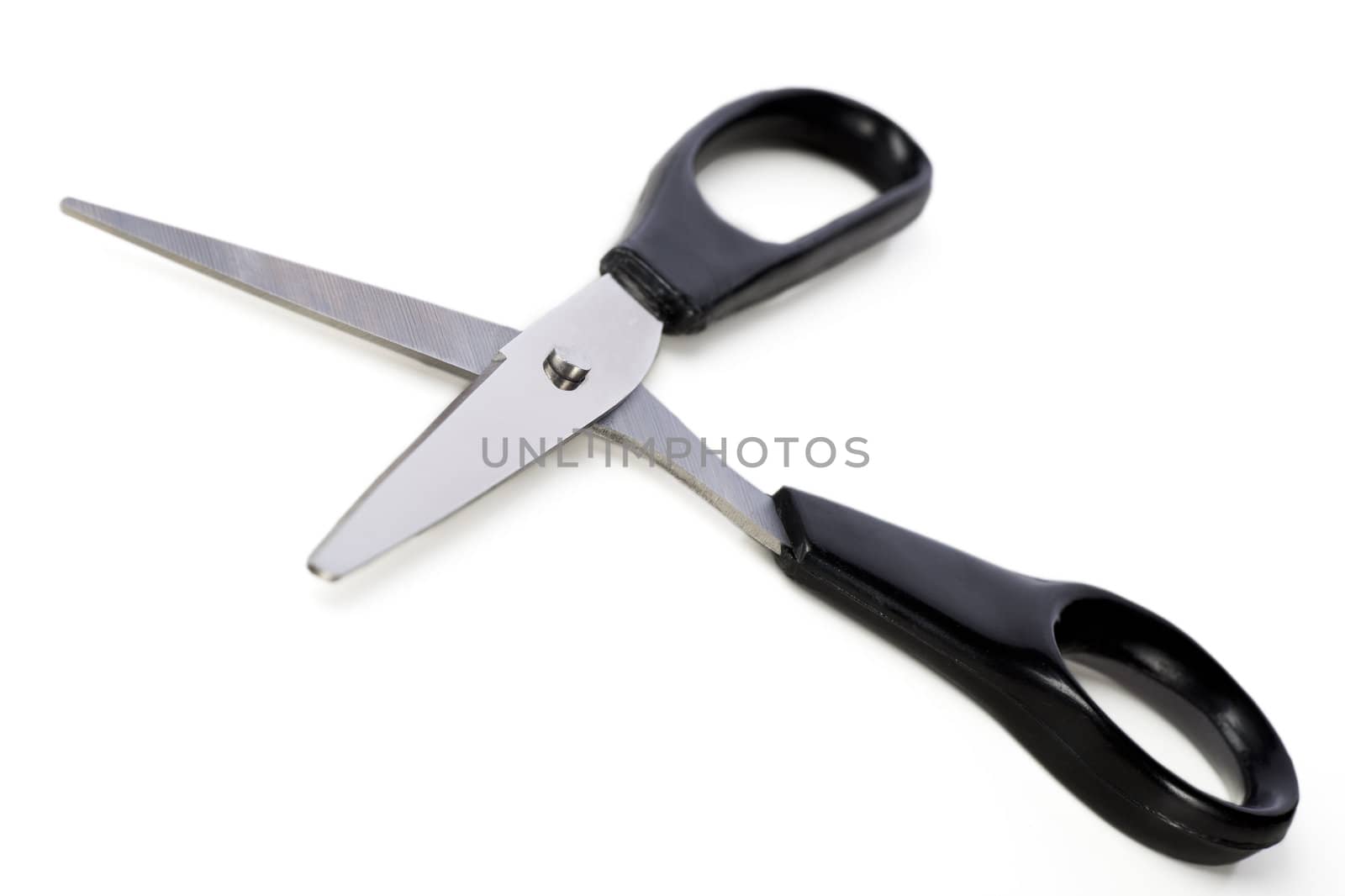 Open pair of scissors isolated on white background.