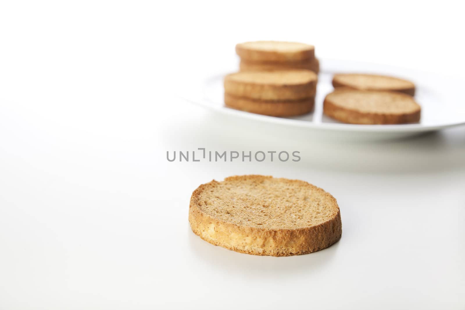 Crispy round Dutch breakfast biscuits isolated on white background.