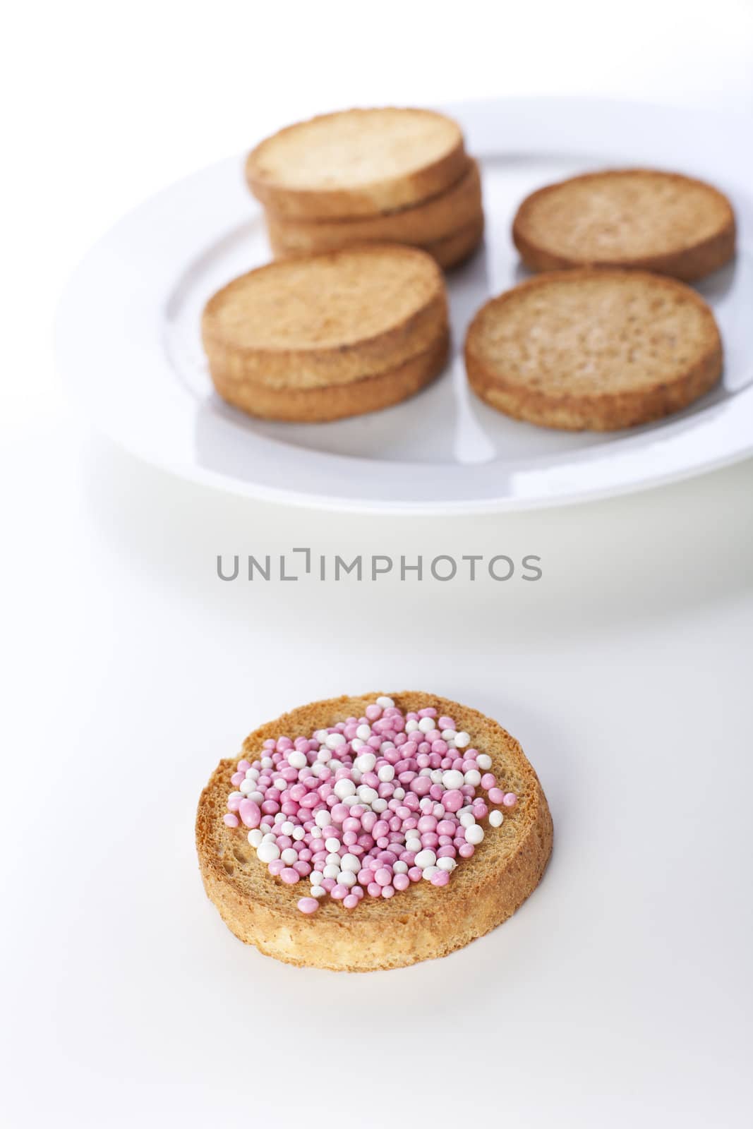 Dutch muisjes: anise flavored candies served on round toast.