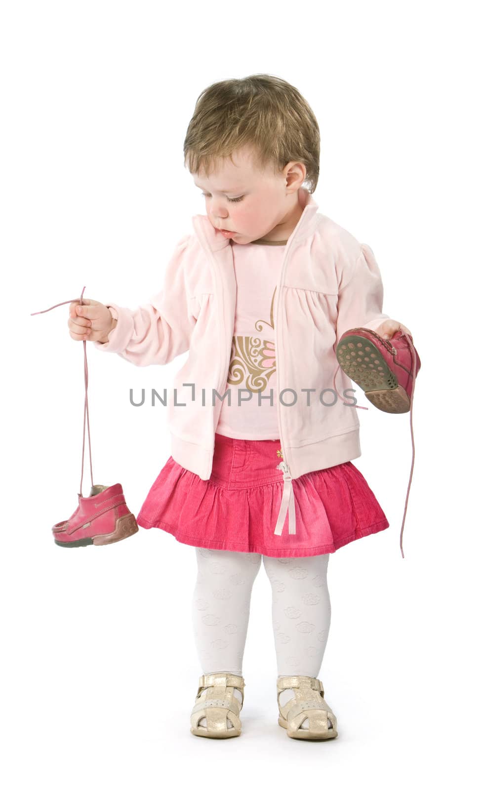 Child with pink jacket. Isolated on white