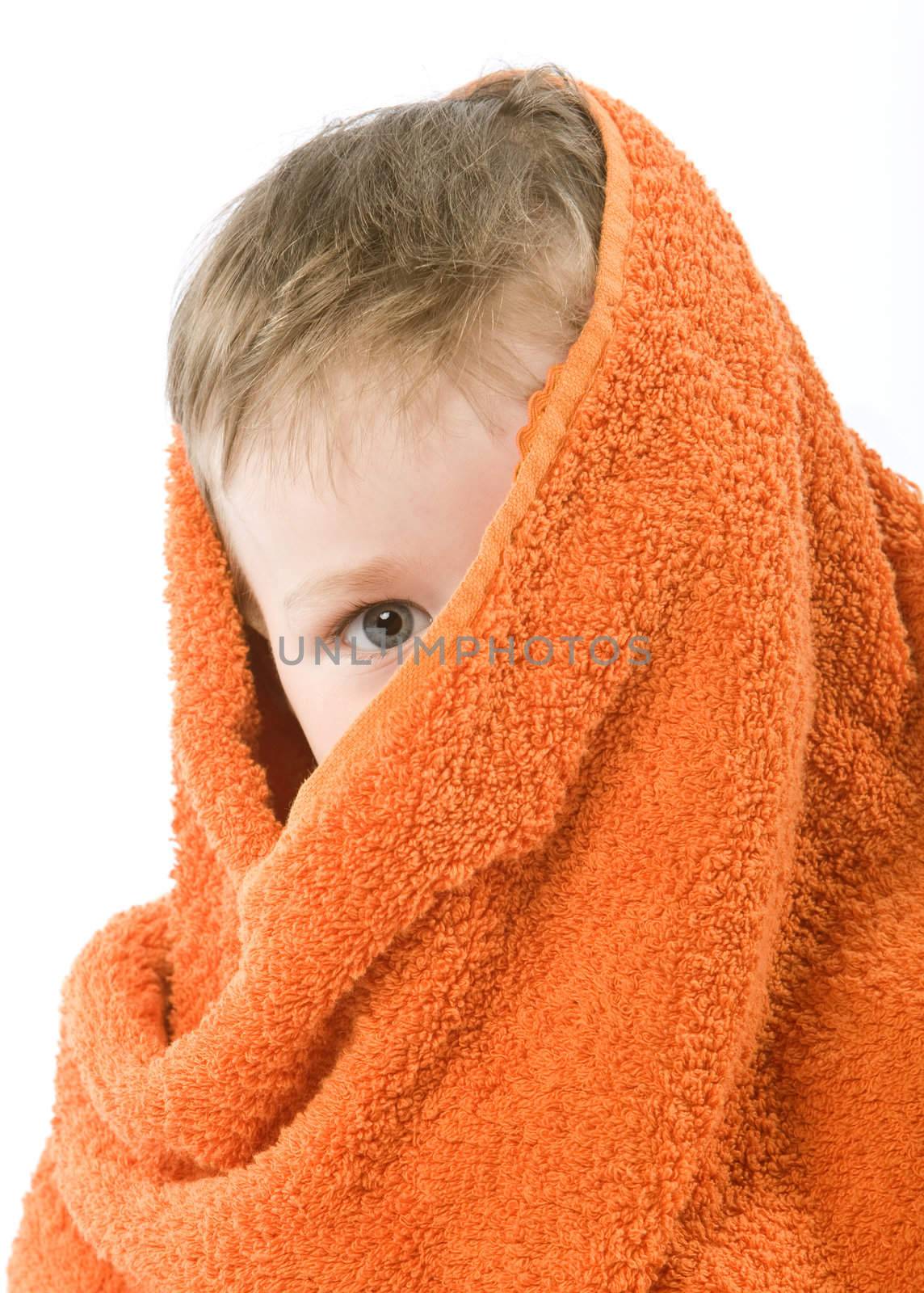 Child in orange towel. Half face hooded