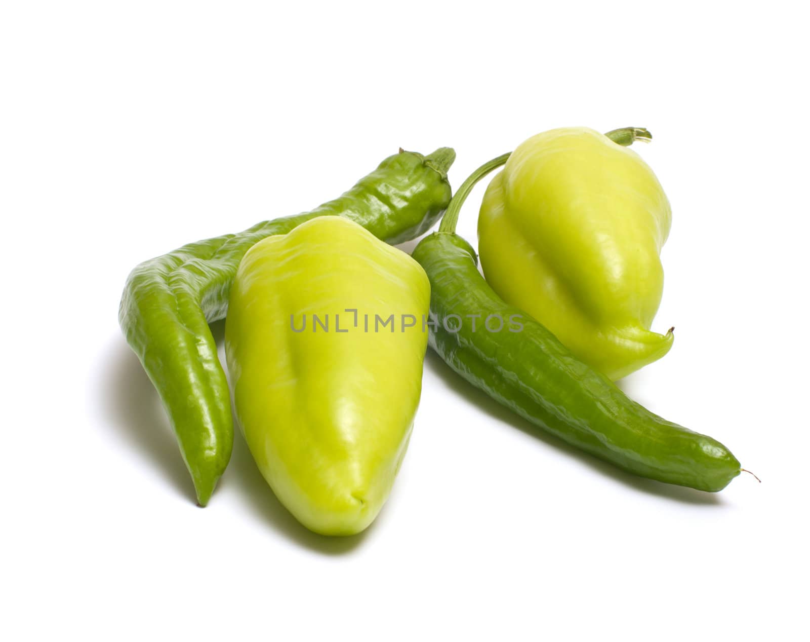 Hot and sweet green peppers isolated on white background.