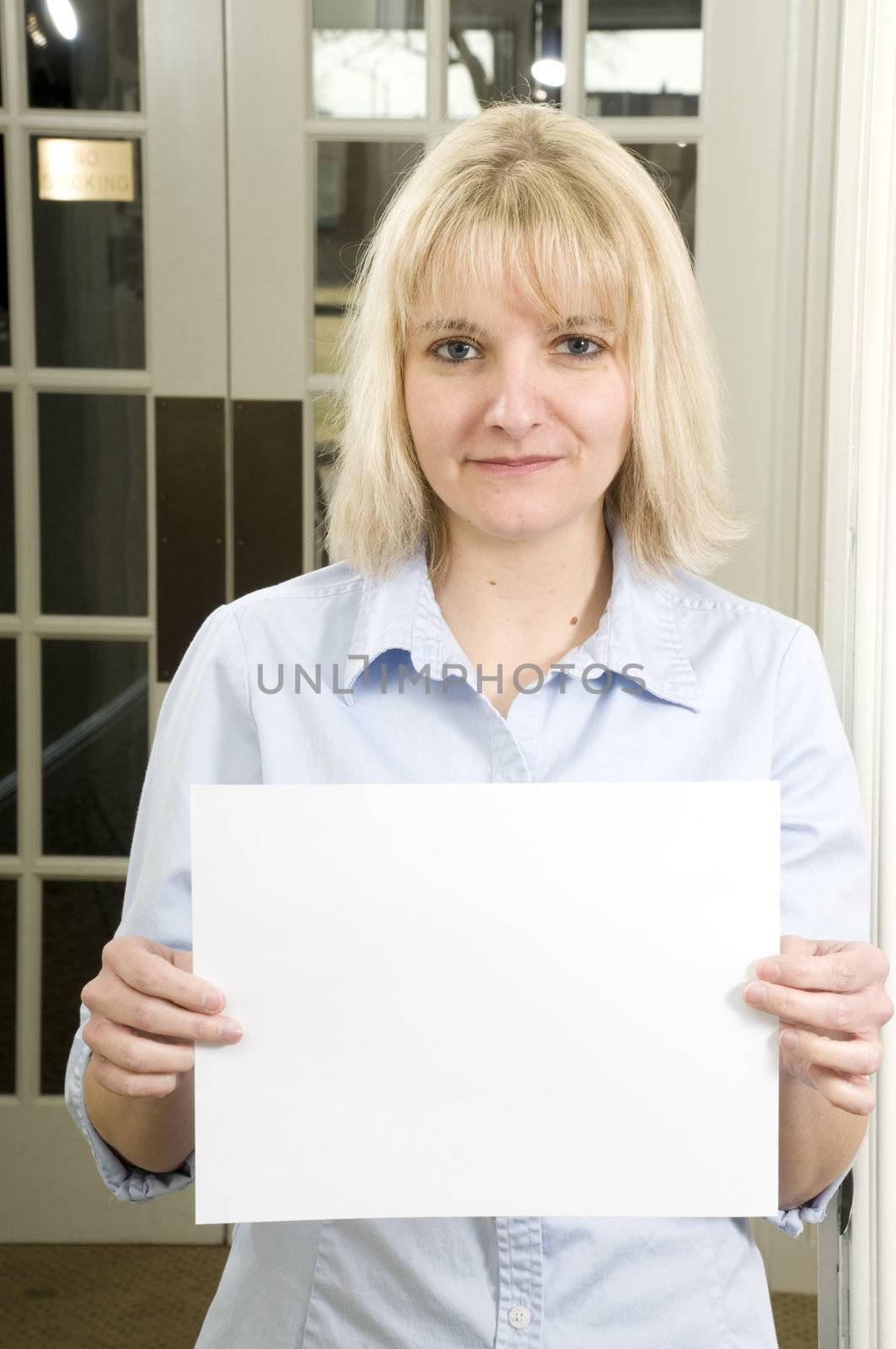 woman with a sign by PDImages