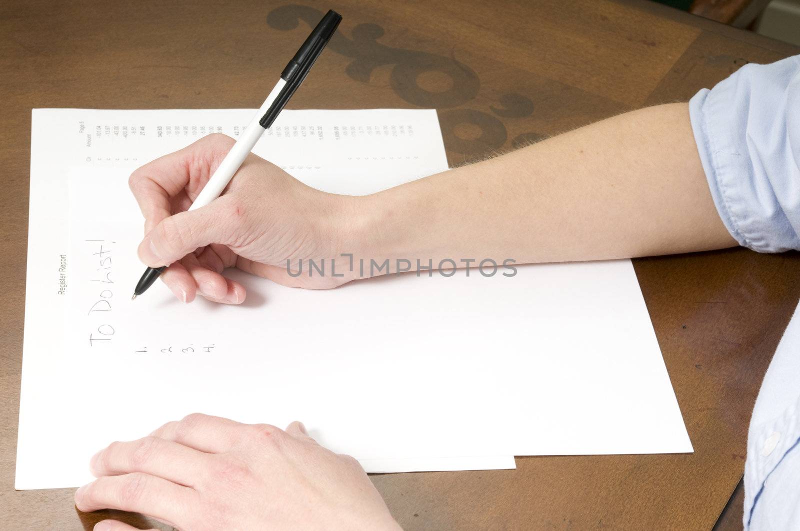 woman taking notes or making a to do list