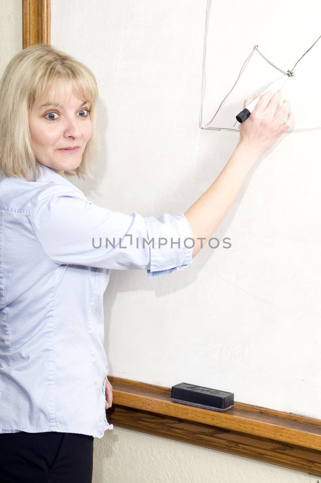 business woman writing on a white board