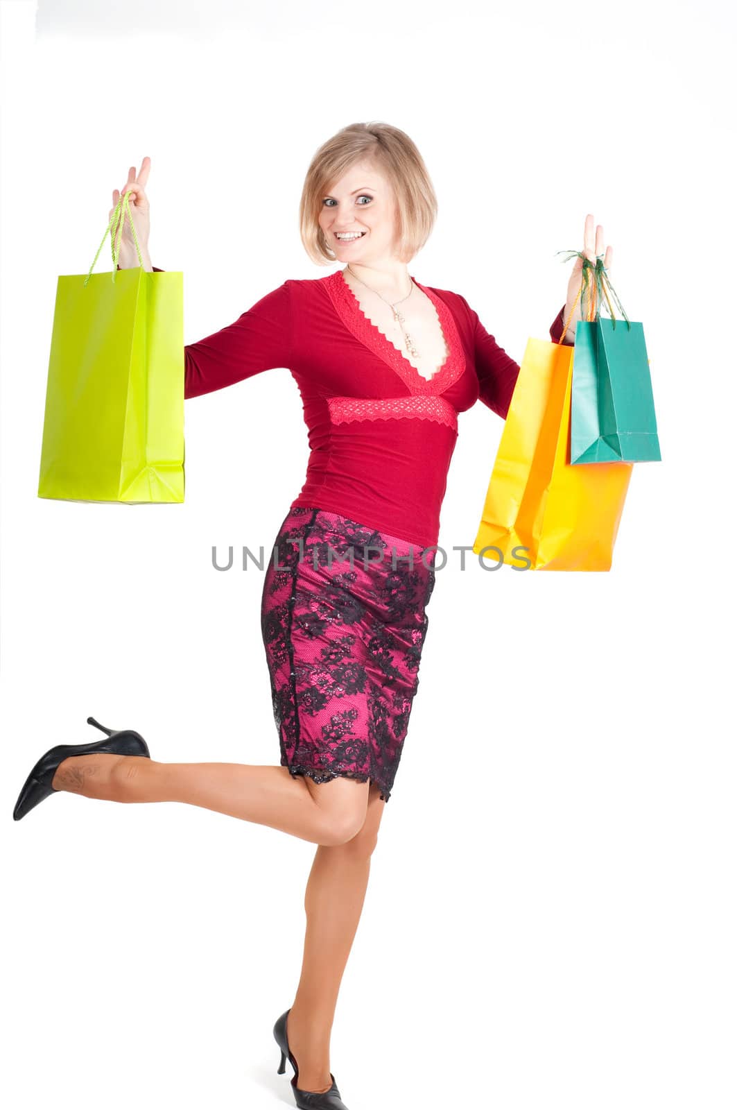 Beautiful woman with shopping bags isolated onwhite