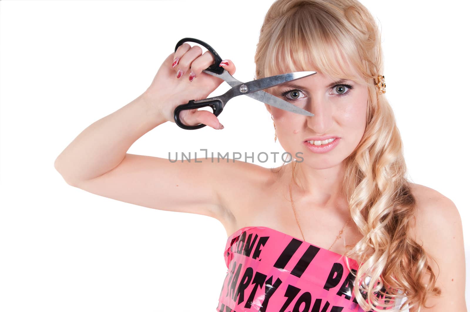 Girl in pink tape dress and scissors isolated on white