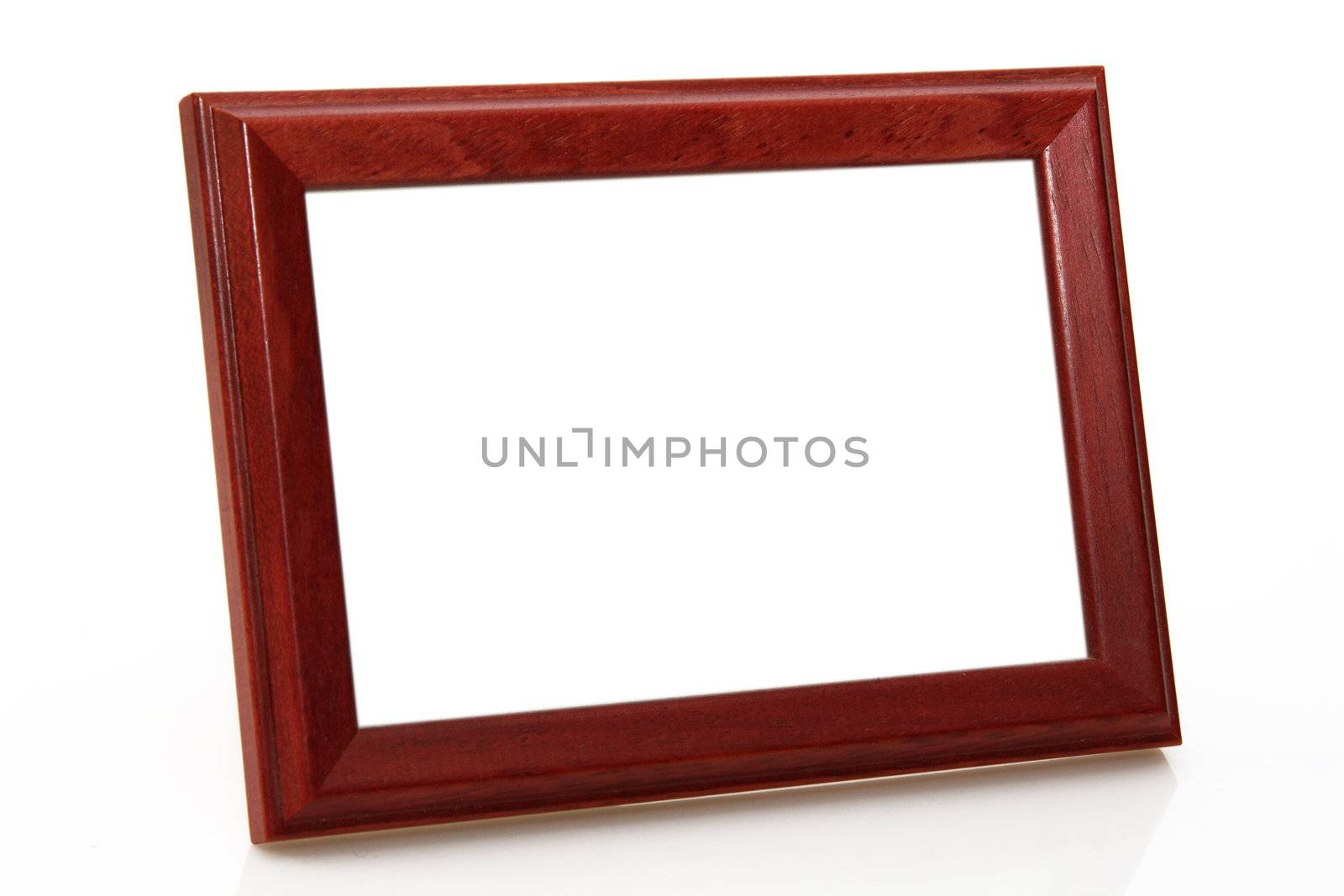 Wooden picture frame on bright background