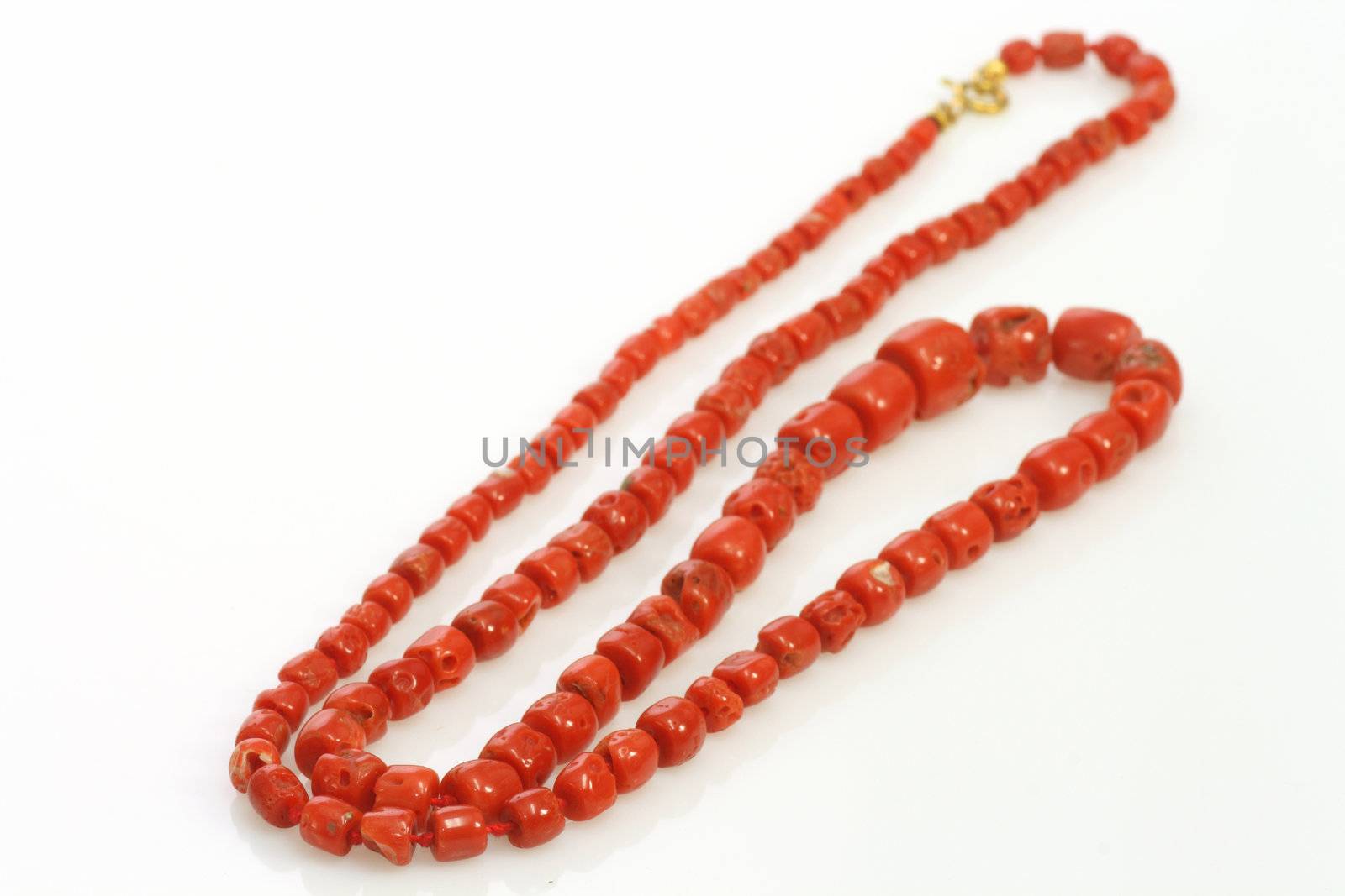 Necklace with perl on bright background
