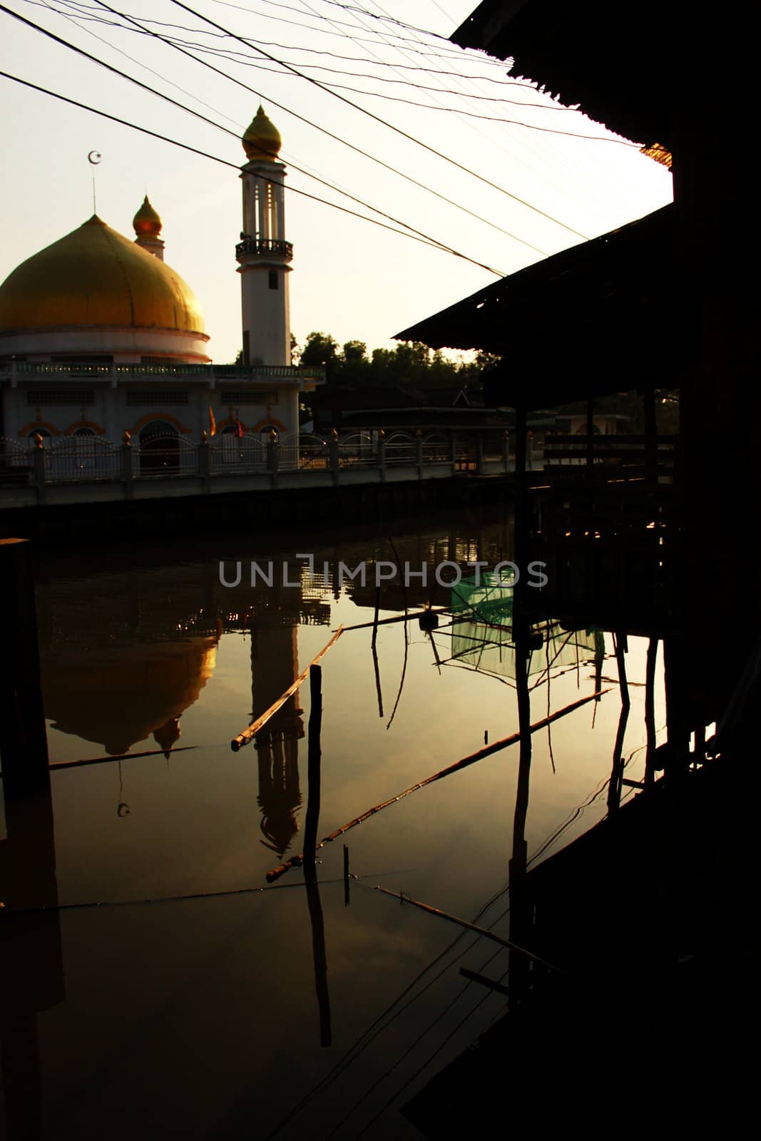 shadow of mosque on the water