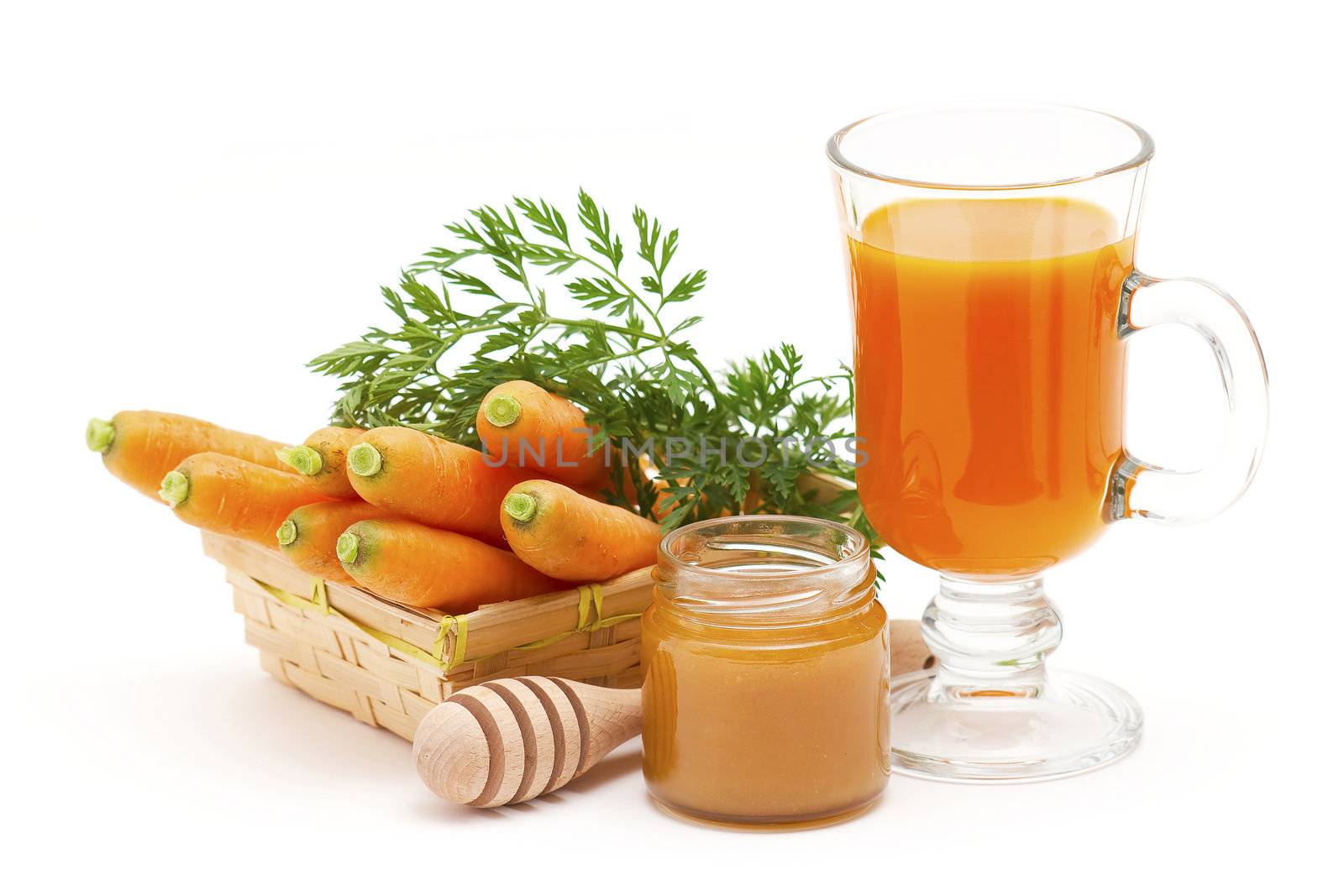 glass of fresh carrots juice with honey