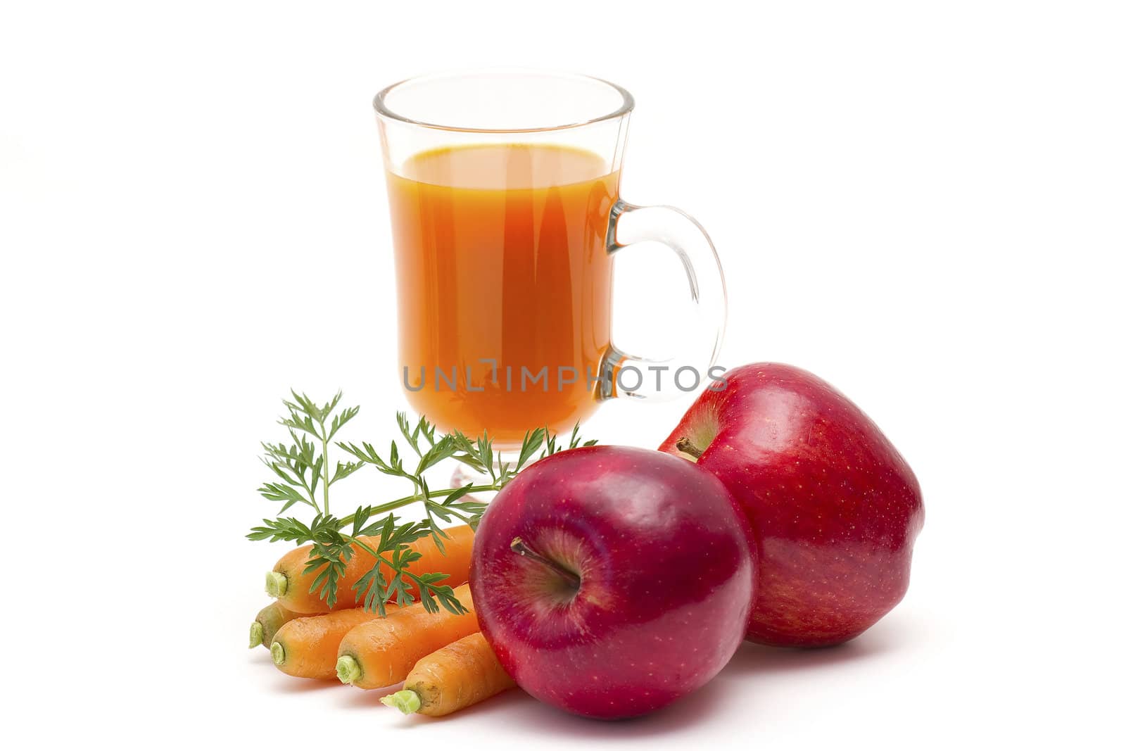 glass of fresh carrots juice with apple 