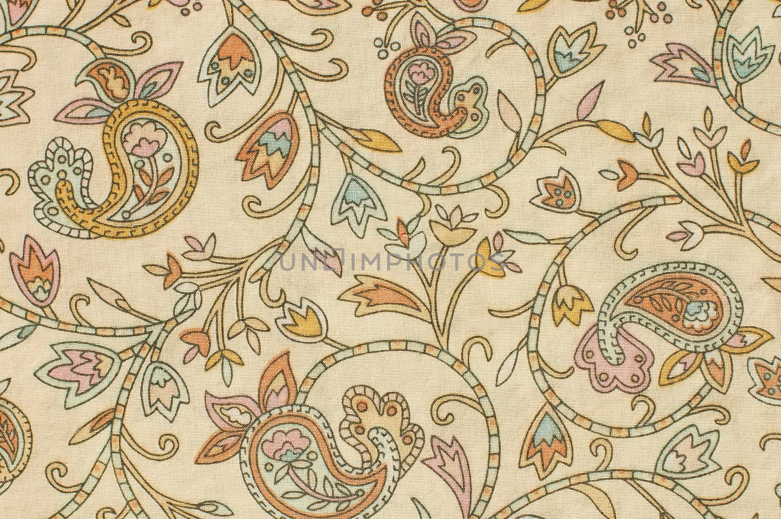 colorful paisley print fabric background on a foundation of beige
