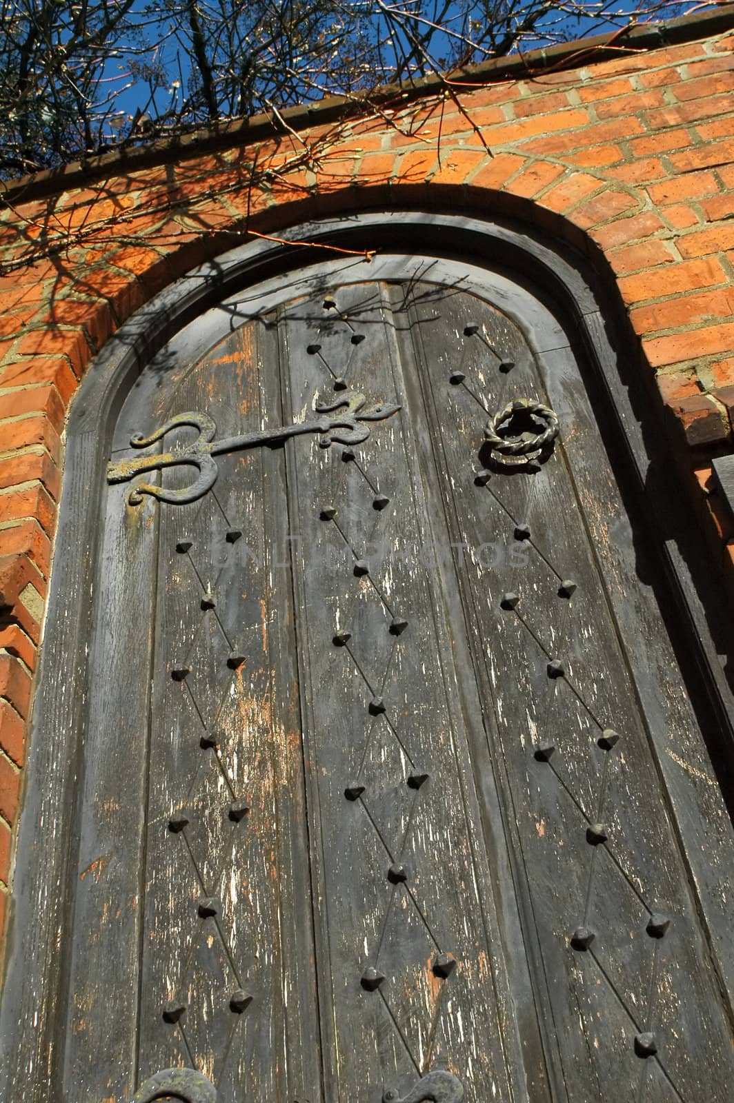 heavy wooden doorway entrance to a secret garden