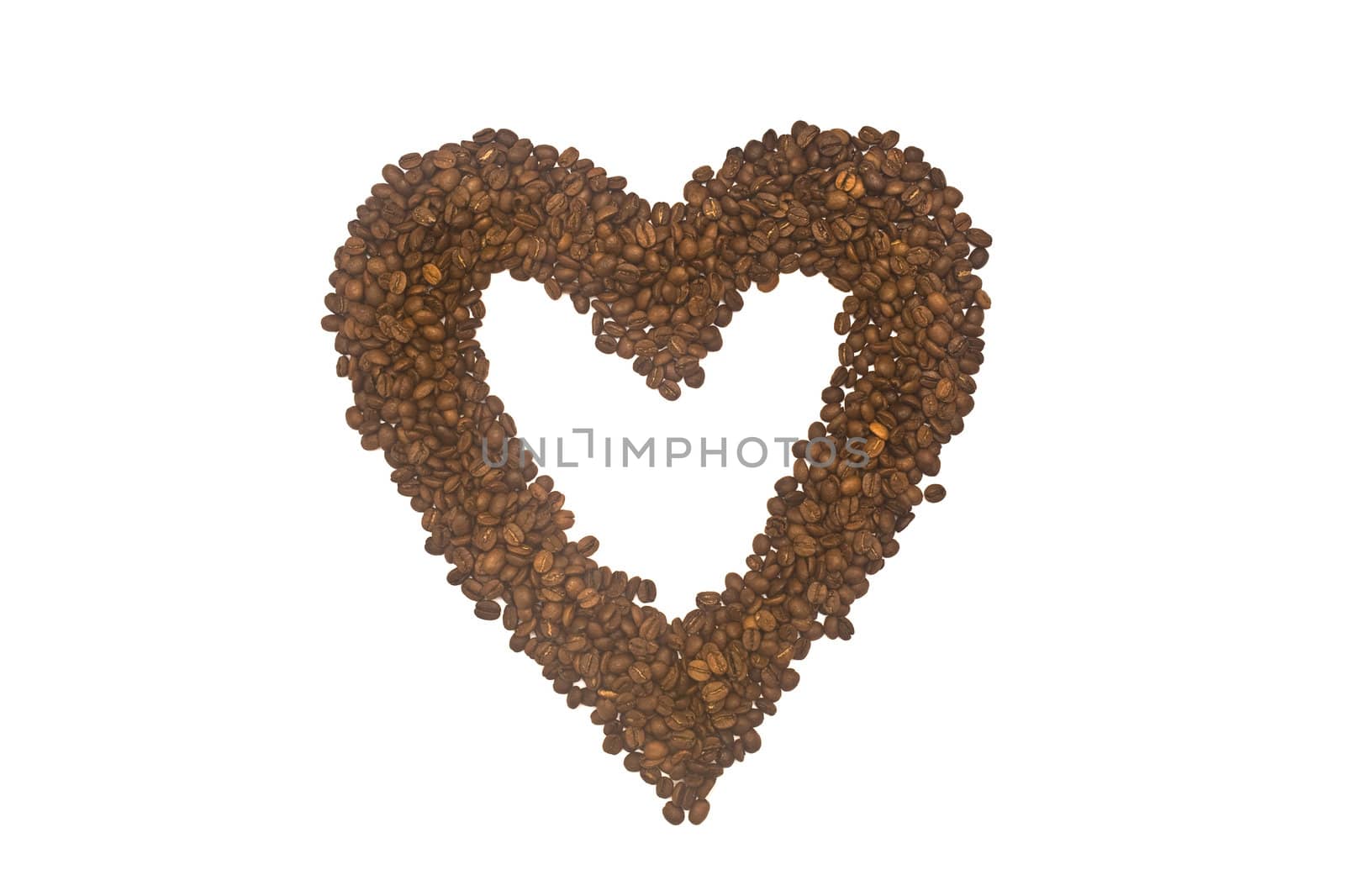 A heart made from roasted coffee grains, isolated on a white background.